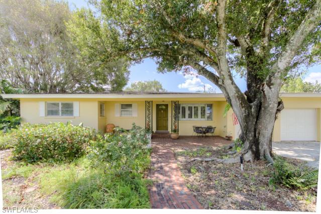 Under a large Oak tree is a beautiful 3BD, 2BA w/2 car garage and a perfect location, large lot 146x160 fenced. This charming home has custom tile, 42" cabinets in kitchen with stone counter top, Viking stone, sub-zero refrigerator & all appliances are stainless steel. Home has formal living & dining rooms w/an enclosed lanai for the perfect reading room and you will love spending time on the large covered porch with a view of the extra-large back yard. Plenty of room for a pool. A wonderful neighborhood to call home.