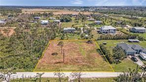 Just under 1 Acre Lot in a very private part of Pine Island. This is a nice area for a new home with plenty of room for all your needs. Close to the Center and marinas for easy water access. The electricity pole and Utility are on the corner of the lot. City water is available. NO Annual HOA fee. The property has been cleared and lawned.