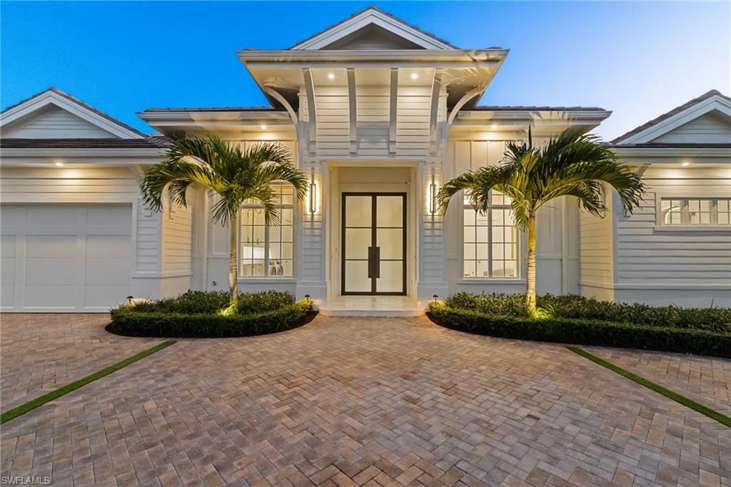 Breathtaking and luxurious, this newly constructed single-story Moorings residence is the epitome of refined coastal living. Crafted with uncompromising attention to detail, the home showcases the highest level of finishes—immediately evident upon entry. Designed for effortless living, the thoughtfully curated floor plan offers four spacious bedrooms plus a private office and four-and-a-half baths, perfectly accommodating both family and guests. 

Wide-plank wood flooring laid in an elegant herringbone pattern adds warmth and visual interest, while bright, airy ceilings enhance the home’s open and inviting atmosphere. The stunning kitchen serves as the heart of the home, featuring a full-height marble backsplash, integrated appliances, and glass-front upper cabinetry for a seamless, custom look. The space flows effortlessly to the covered, southern-facing lanai—ideal for entertaining—with a summer kitchen, fireplace, and electric screens and shutters. 

The primary suite is both sophisticated and serene, offering a private seating retreat and a picture-perfect bath complete with reeded detailing, a dramatic glass-enclosed wet room, a sculptural freestanding soaking tub, and terrazzo flooring that adds a subtle textural twist. 

With too many notable details to list, this exceptional Moorings residence is located in the sought after X zone and is truly a must-see for the most discerning buyer—ideally located on a quiet street in one of Naples’ most coveted neighborhoods.