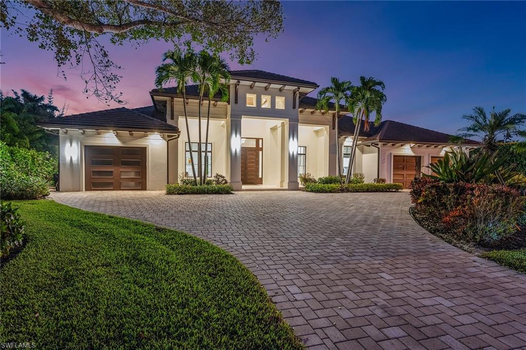 This Naples home blends European craftsmanship with modern luxury. The Italian-designed kitchen by Idea Group boasts highest-grade quartz countertops, Wolf and Sub-Zero appliances, a double oven and an oversized walk-in pantry, ideal for cooking and entertaining. Inside, Rolf Benz indoor furniture and Restoration Hardware lighting create an elegant atmosphere. Each of the four bedrooms and 4.5 baths features unique design elements, with Porcelanosa finishes in the baths adding a touch of luxury. The outdoor space is designed for relaxation and entertaining, with rolldown screens for privacy, and a stunning pool with fire and water features. Restoration Hardware outdoor furniture completes the setup for alfresco living. The home is equipped with a Pentair water filtration system and a 1,000-gallon propane tank for convenience and efficiency. Additional highlights include a wine cooler, powder room and a three-car garage. This home offers high-end design and thoughtful details, making it ideal for those seeking a refined lifestyle in Naples. Don't miss the opportunity to see this exceptional property!