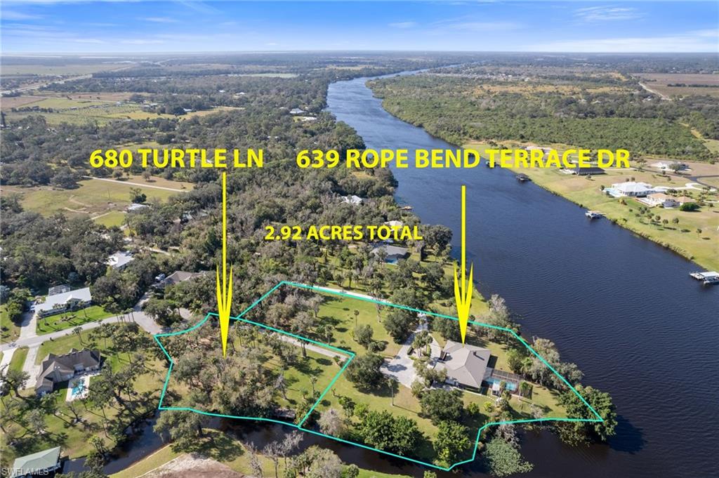 2 Lots + 1 existing large waterfront pool rancher —- only 1 Price. RARE: 50% WATERFRONT on 2 sides = Endless POTENTIAL Escape to the charm of RURAL OLDE FLORIDA with this RARE, OVERSIZED INVESTMENT.  
opportunity on a TOTAL of 2.92 stunning RIVERFRONT & CANAL FRONT ACRES. Nestled on the Caloosahatchee River, this property boasts navigable water on TWO sides, offering unparalleled country river views and serene, peaceful living. *** Featuring TWO lots: 639 Rope Bend AND 680 Turtle Lane (MLS# 225001638). This combined property includes a BOAT RAMP, dock, AND the ADJOINING (.81 ACRES) TURTLE LANE LOT, offering nearly 3 ACRES OF WATERFRONT PROPERTY!!  Perfect for water enthusiasts, and is shaded by majestic live oak trees draped with breezy moss - creating a picturesque & peaceful setting for your dream estate. The existing home on the Rope Bend lot is just over 3,000 square feet and is a blank canvas awaiting your personal touch and creativity to
reimagine. Close your eyes and be transported to cool Florida evenings by the fireplace; with 3 sets of French doors open to your expansive pool deck with an abundant shaded area and large pool overlooking the breathtaking water on 2 sides.
This tranquil retreat  rewinds time to Olde Florida charm and solitude.  It’s more than a property - it’s a feeling that is worlds away from the hustle and bustle of day to day life, yet it’s conveniently located to several modern conveniences, including: just one minute from O’Reilly Auto Parts, three minutes from Walmart and Tractor Supply, and four minutes from Culver’s and Labelle Brewery. Only an easy 40 minutes from SWFL airport for snowbirds! Carve out a beach day on Sanibel Island or Fort Myers Beach - just an hour drive
away.
Whether you’re dreaming of a peaceful country escape, a place for horses, private parking for your RV and boats, or an INVESTMENT to SUBDIVIDE with endless potential to build out the Turtle Lane lot as a guest house or to sell off separately - - - this property delivers it all!  You will not find nearly 3 WATERFRONT acres with so much potential anywhere else in LaBelle on the active market. Don’t miss this extraordinary opportunity to create your perfect riverfront lifestyle!