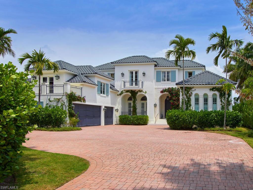 A home that evokes luxury as expansive as the water views from your private backyard, located in the internationally renowned community of Port Royal. The flowing first floor features a great room and adjacent gourmet kitchen with oversized, stone center island, along with walk-in wine room, wet bar, family and formal dining, and study. Walk through fully pocketing glass doors to a generous open-air living space, with an outdoor kitchen and abundant room for covered seating and dining, overlooking a paver-finished terrace, spa, pool, landscaped yard, and new boat dock. From the striking, two-story entryway, look straight ahead past the stone fireplace and through the formal living room to the waterfront. Just down a private hallway is the master suite, and an eye-catching staircase leads to the second level with 5 additional en suite bedrooms, media room, and sitting room. Built securely and to last, the home spans 8,223 square feet of living space and 10,112 total square feet. You won’t have to ask twice to entice family and friends to make themselves right at home.