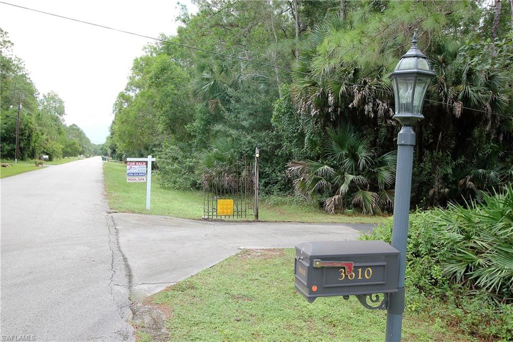 One of Kind in the Estates, 3.75+ Acres with Newer Tile Floors, Large open living room, Bright Sunny Kitchen, w/Newer Appliances, Comfy Styled Split Bedroom plan with a Spacious Master Suite + Large Walk-in Closet. There's also a High Caged Screened Lanai w/outside Shower, Spa and more. Outbuildings with shed and work stations. Newer water condition system that is fully owned. If You're looking for a CLOSE-IN Beauty priced Under $300,000 with room to grow this is the Newest location for you!