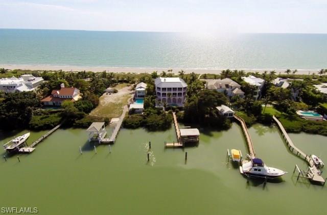 PRICE REDUCED!!!! SELLER WANTS IT SOLD! Priced below reproduction. Island Style Architecture that provides a relaxed balance between indoor & outdoor living. This luxurious 6 Bedroom Gulf to Bay Beach House features an open design, that captures breathtaking vistas from every room. All the amenities & quality expected, relax & enjoy spacious multi level front and back lanais for everyone to enjoy, a warm & inviting study, live-in guest quarters, elevator, pool & spa area, lush tropical grounds & the best multi space deep water dock at the mouth of the Bay. Have fun, relax, rejuvenate, be pampered. It is all realized here.