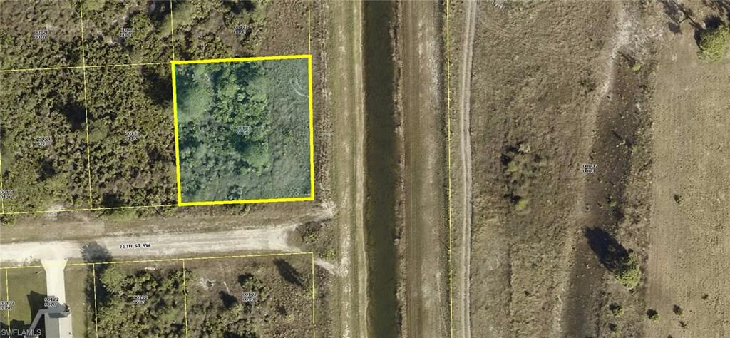 Really nice high and dry generous oversize on-canal end of dead end Golf Course and Canal view homesite (125 x 130 ... over 1/3 acre) with desirable Northern Exposure at rear of property in a quiet area of LEHIGH ACRES with Canal and Golf Course views. This property is mostly clear with low secondary growth and grasses with Southern views facing the street with quick and easy access to State Road SR-82 and Lee Boulevard, restaurants and shopping. Build your dream or vacation home now and/or save this special area oversize home-site for later. This premium homesite last sold in 2005 for $25,000. Don't miss this unique opportunity to purchase this oversize on-canal homesite now for only $7,995 with SELLER DIRECT FINANCING with $0 (ZERO) down, no credit check or income or job verification for ONLY $97.00 per month payment. Personal checks OK. Call today... you'll be so glad you did.