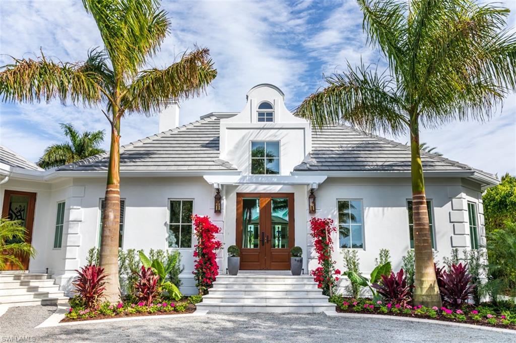 Every buyer’s dream! Port Royal’s newest gated jewel is located on one of the most coveted streets and waterways in Naples. Remastered in a down-to-the-studs transformation by Oakley Home Builders. The apex of today’s luxury living is expressed in couture finishes, soaring ceilings, indoor/outdoor living, a large working library, ensuite bedrooms and an open kitchen and family room. From the gallery, you are ushered inside as your eyes are drawn towards views of Runaway Bay and wide waterways. The great room folds into a large loggia with a fire feature and overlooks a magnificent outdoor entertainment area with pool, spa and dock. Whitewashed and parapet walls create the ambiance of a coastal paradise and tantalize the senses. New everything - roof, windows, mechanical systems and doors - plus eligibility for Port Royal Club membership.
