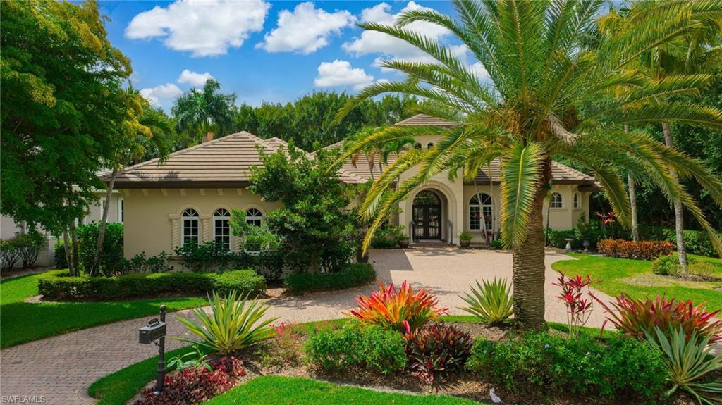 Welcome to a beautifully positioned residence within the award-winning community of Miromar Lakes Beach & Golf Club, where refined living and natural beauty come together in perfect balance. This thoughtfully designed home features four bedrooms plus a den and three and a half bathrooms, offering a spacious and flexible layout ideal for both everyday living and entertaining.

Inside, the formal living area is warm and inviting, centered around a fireplace that adds both elegance and comfort, creating the perfect setting for intimate gatherings or quiet evenings at home.

Step outside to a truly special outdoor setting where the lanai becomes your own private retreat. Surrounded by lush, mature landscaping, this space is designed for tranquility and seclusion, offering a peaceful backdrop for everyday living and entertaining. The outdoor living area is equally impressive, featuring its own fireplace for cozy evenings, along with a beautiful pool and spa that invite you to relax and unwind year-round. The carefully curated greenery enhances both beauty and privacy, allowing you to fully enjoy the Florida lifestyle with a sense of calm and comfort that feels worlds away.

Beyond the home, Miromar Lakes offers one of the most extraordinary amenity packages in the country. Centered around a stunning 700-acre freshwater lake, residents enjoy three miles of private white-sand beach, creating a rare coastal-inspired lifestyle in an inland setting. Days can be spent boating, paddleboarding, kayaking, or simply relaxing along the shoreline.

The community’s iconic Beach Clubhouse serves as the social and lifestyle hub, offering elegant waterfront dining, indoor and outdoor lounges, and a full calendar of curated events. A zero-edge infinity pool overlooks the lake, while multiple dining venues, from casual beachfront settings to fine dining, create a vibrant culinary experience just moments from home.

For those seeking an active lifestyle, Miromar Lakes features a championship golf course, a full-service wellness spa, a state-of-the-art fitness center, and an active racquet club with tennis and pickleball. Two marinas, scenic walking paths, a botanical park, and a dynamic year-round social scene further enhance the community’s appeal, offering something for every interest and pace of life.

This residence offers more than just a place to live. It is an invitation to experience privacy, comfort, and an unmatched level of amenities in one of Southwest Florida’s most celebrated communities.