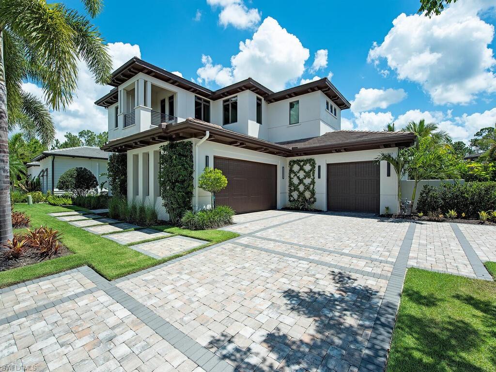 Stunning architecture and exquisite modern landscaping welcome you to this astounding estate built in 2020. Crisp, clean lines accentuate the coastal contemporary design throughout the interior & exterior of the home. Volume ceilings in the grand foyer lead into a spacious open floorplan flowing effortlessly between the formal living room, dining room & expansive kitchen. Light wood floors enhance the abundant natural light flowing throughout. A large center island creates a gathering place in the kitchen with top-of-the-line built in appliances encapsulated in white cabinetry. The primary suite welcomes relaxation with a delightful master bath complete with his & her vanities, soaking tub & gorgeous shower. An intimate home office is located just off the main living area. The second story loft is the ideal gathering place for guests. A delightful outdoor gas fireplace & summer kitchen extend entertaining opportunities into a private outdoor oasis. The sparkling spillover spa & pool invite you to soak up the sun amidst lush landscaping. Mediterra provides an abundance of amenities including two Tom Fazio designed golf courses, sports club & exclusive members only Beach Club.