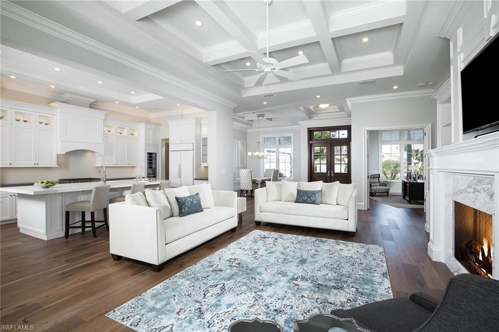 Coastal contemporary design and clean lines define this beautiful British West Indies-style home. Showcasing meticulous attention to detail, this sophisticated residence features volume ceilings, custom woodwork and hardwood floors throughout. Perfect for gourmet meals, the light and bright kitchen includes an island and walk-in pantry. A luxurious master suite, second master suite and a spacious great room with fireplace are found on the main floor. Ten-foot sliding glass doors invite the outdoors in and open up to a tropical oasis with sparkling pool, fountain and spa. Ideal for guests, the private upstairs offers three en-suite bedrooms, family room and wet bar. Owners will enjoy the close proximity to Park Shore beach access and The Village at Venetian Bay. As a Park Shore resident, voluntary membership to the private Park Shore Association is available.