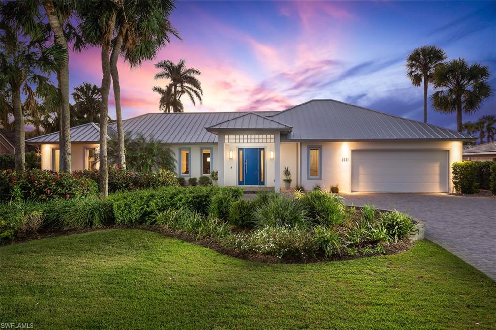 Thoughtfully remastered by Knauf-Koenig Group, this coveted western exposure Pelican Bay Woods estate features an oversized .42-acre lot, abundant privacy, and stunning mature landscaping. The 4,000+ sf residence has an appealing open-concept floor plan, natural light throughout, voluminous ceilings, and beautiful hardwood floors that complement every room. The sleek, modern kitchen boasts beautiful, high-end, built-in appliances and a large waterfall edge kitchen island. With 4 bedrooms and 4 1/2 baths, an open concept great room/kitchen/family room, and generous lanai overlooking a 42’ lap pool, all nestled in a gorgeously landscaped and very private backyard, this home is move-in ready. Buyers will appreciate the 2+ car garage, standing seam metal roof, and hurricane rated doors and windows throughout. At a finished floor elevation of 13.2’, the residence is located in flood zone X and sustained no damage during Hurricane Ian. It’s ideally located within walking distance to Artis Naples, Waterside Shoppes, Publix, and 2 private Pelican Bay beach clubs. Pelican Bay is the hottest Naples location with 3 miles of deeded beach, an active tennis program, 27 holes of golf, and more.