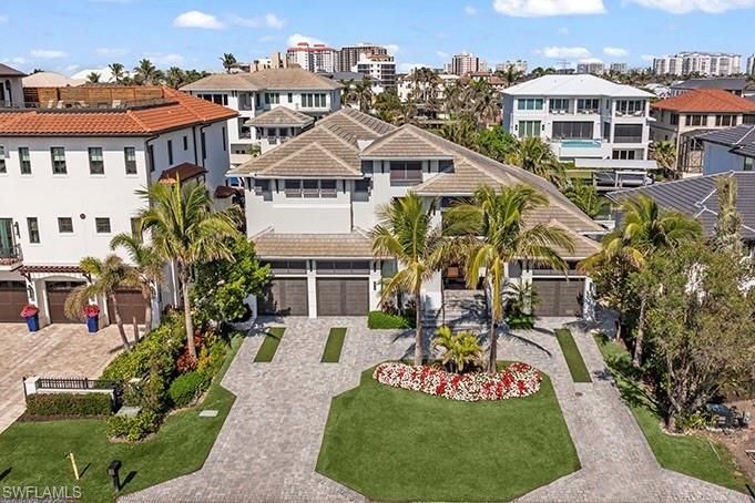 LOCATION, LOCATION, LOCATION! This exquisite custom home is perfectly positioned in the sought-after Gulf Shore Drive section of Vanderbilt Beach, within the exclusive Conners neighborhood. Just one house away from Gulf Shore Drive, it sits on desirable Bayview Avenue directly across from the beach, offering the ultimate coastal setting.
Built in 2020, this coastal masterpiece blends modern elegance with timeless craftsmanship. The thoughtfully designed open floor plan with soaring volume ceilings creates an airy, light-filled environment ideal for both relaxation and entertaining. The luxurious ground-floor primary suite is complemented by three additional en suite bedrooms, providing comfort and privacy for family and guests. A dedicated study and sophisticated open kitchen with a large island enhance functionality and style.
The home also includes a second laundry room conveniently located on the second floor, adding to its practicality. Designed for hosting or simply enjoying the Florida lifestyle, the outdoor living spaces are truly exceptional. The screened lanai and open patio feature multiple seating areas, a built-in grill, outdoor fireplace, and a full outdoor kitchen. The resort-style pool and spa complete this private retreat.
For boat enthusiasts, a custom dock accommodates vessels up to 42 feet, offering direct access to the bay and beyond. Impact-resistant doors and windows, a whole-house generator, and electric shutters provide security and peace of mind. A generous three-car garage offers ample space for storage and parking.
This remarkable residence represents the best of Naples waterfront living—where luxury, design, and location meet to create the quintessential coastal dream lifestyle. Bonus-in addition, this property offers an opportunity to be part of the newly formed Paraiso Beach Club. Enjoy two beautiful restaurants, multiple pools on the beach and luxury beach living.
