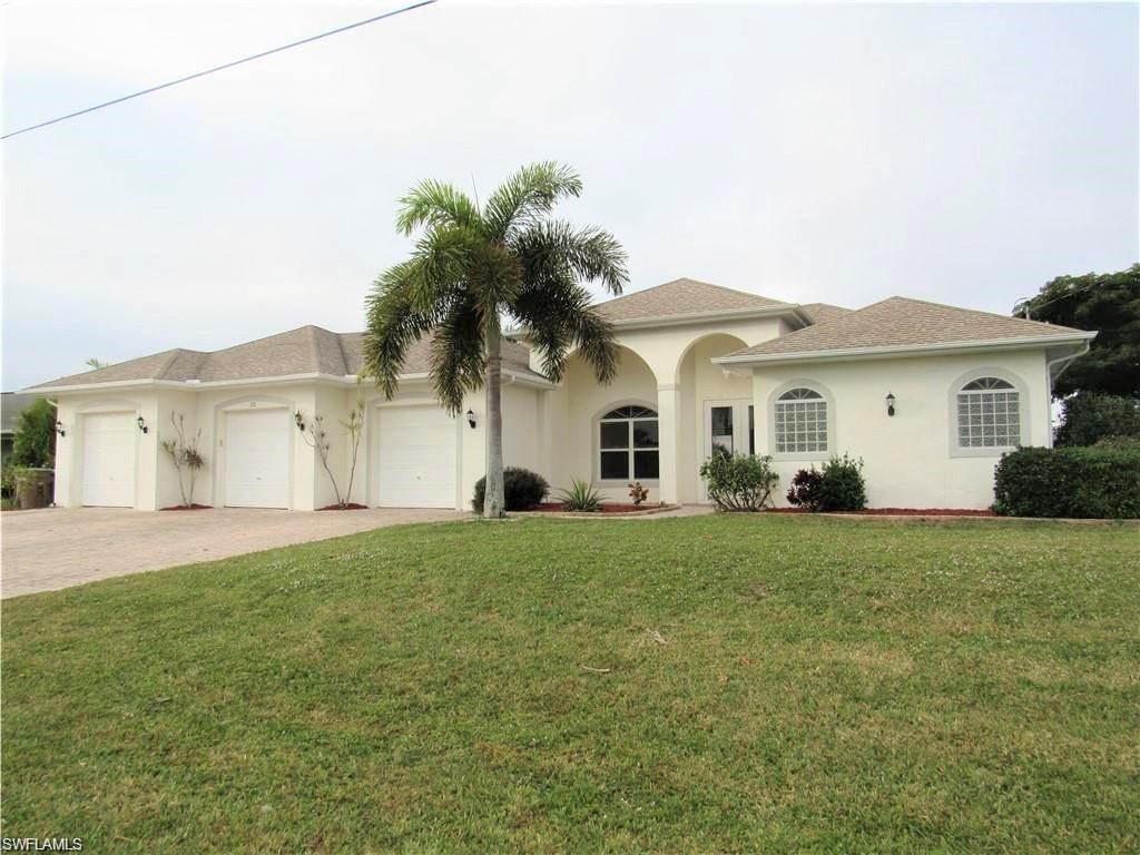 GORGEOUS DREAM WATERFRONT POOL HOME AT CAPE CORAL, 3 BEDS 3 BATHS SINGLE FAMILY HOME READY TO MOVE IN, TRIPLE LOT, TRIPLE CAR GARAGE, 4th GARAGE DOOR ON BACK FOR BOAT ACCESS, SUPER CLOSE TO BURNTSTORE RD BOAT RAMP AND CORAL OAKS GOLF COURSE, LARGE BRICK PAVER DRIVEWAY, TOTAL CONSTRUCTION OVER 4,800 SQFT, HIGH CEILINGS, GLAMOROUS ENTRANCE, ALL TILED AND LAMINATE ON THE BEDROOMS, VERY SPACIOUS KITCHEN , STAINLESS STEEL APPLIANCES, TALL SLIDING DOORS, MASTER BEDROOM WITH MASTER CLOSET, SHOWER AND BATH TUB WITH DOUBLE SINK WITH DIRECT SLIDING DOORS WITH VIEW TO THE POOL AND AFTERNOON SUNSETS, EACH BEDROOM WITH ITS PRIVATE BATHROOM,  PRIVATE LAUNDRY INSIDE THE HOUSE WITH WASHER AND DRYER, OVERSIZED SCREENED LANAI WITH A SALTED WATER POOL WITH A STUNNING VIEW TO A WIDE CANAL WITH THE FAMOUS WEST COAST SUNSETS, PERFECT TO ENTERTAIN GUESTS, SIT FOR A SUNBATH OR SIMPLY TO RELAX AND READ A BOOK. SEAWALL WITH A CONCRETE DECK,  7 MILE CANAL, GREAT FOR FISHING  OR CRUISING, CAPE CORAL RANKED TOP U.S. CITIES TO LIVE IN.