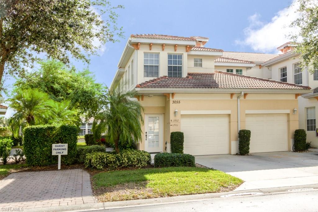 MUST SEE this beautiful light and bright lakefront end unit on the first floor featuring 3 bedrooms, 2 bathrooms, and an attached garage. This unit is the perfect seasonal or year round home sold beautifully furnished, with desirable southern exposure! Upgraded tile throughout, soaring volume ceilings, large master suite with walk in closets and nice bath all in this truly ideal location in a gorgeous, well-maintained lakefront community. Friendly and social community events all year round,on-site management, a resort style pool, screened-in lap pool, tennis, steam room and sauna, fitness center and more!