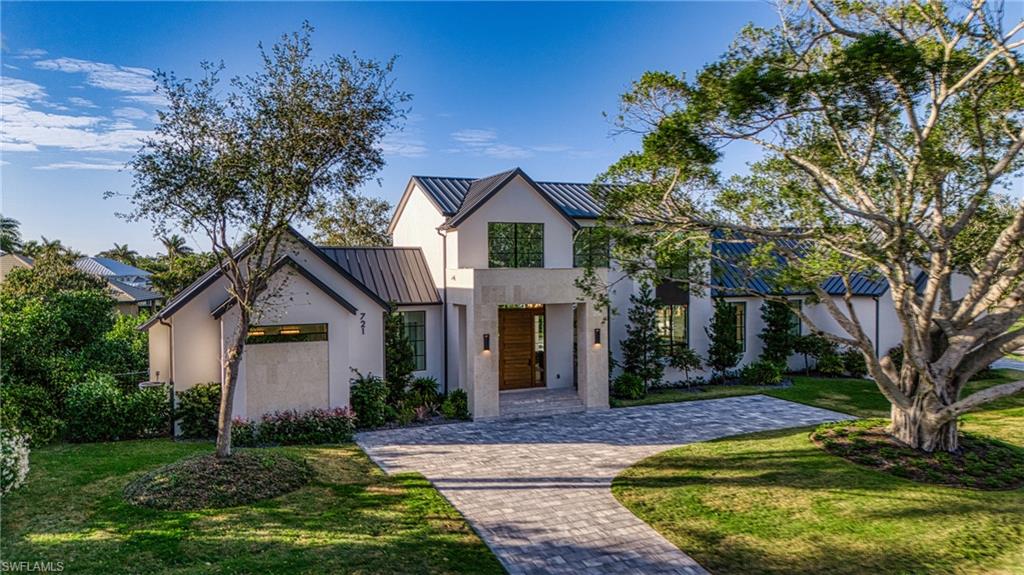 Discover refined elegance and timeless sophistication in this impeccably designed modern farmhouse nestled in Naples, FL, envisioned by the esteemed architectural firm H-Level. Graced with 4 bedrooms and 4.5 bathrooms, this residence exudes an understated luxury that resonates throughout every detail. From the graceful wood flooring to the bespoke steel staircase, each element harmonizes seamlessly, offering a serene ambiance that beckons relaxation. The chef's kitchen, adorned with top-tier appliances and marble countertops, invites culinary exploration and intimate gatherings. Unwind by one of the two inviting fireplaces, or bask in the tranquility of the resort-style pool and spa under the Florida sun. Whether seeking a permanent haven or a seasonal retreat, this distinguished modern farmhouse offers a sanctuary of refined living and understated Elegance. Furnishings provided by Robb & Stucky Interiors & Furnishings.