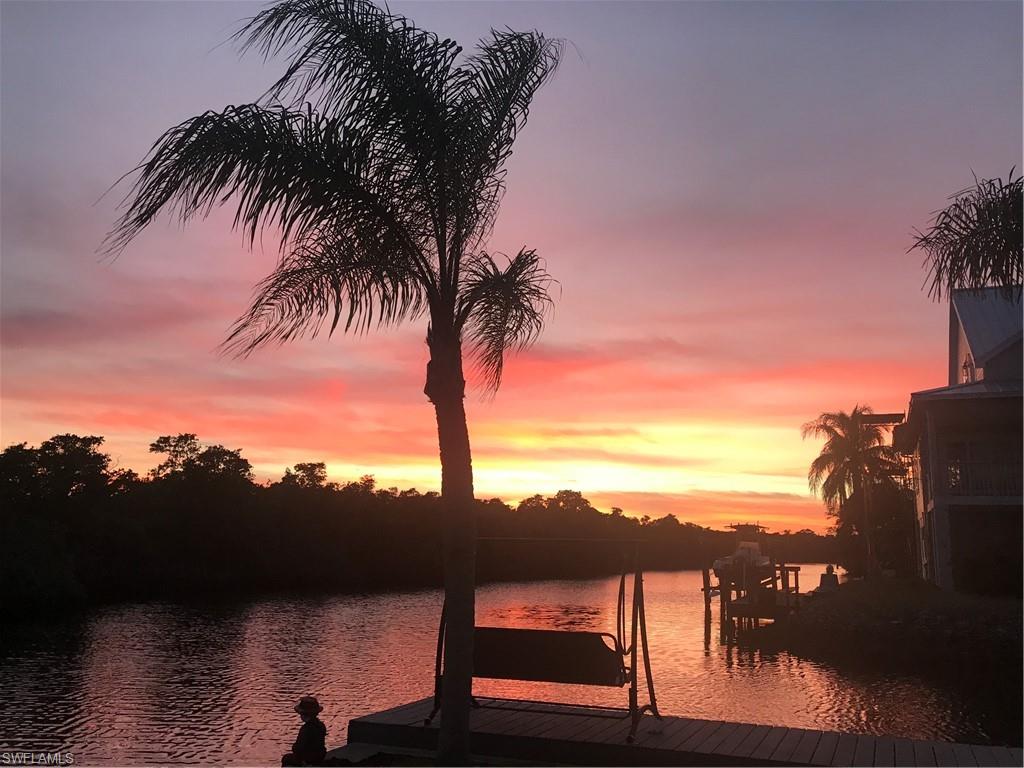 Experience the pinnacle of waterfront living on this extraordinary Gulf access point lot with over 200 feet of pristine waterfront that gracefully wraps around the property. With two private boat docks, 13,000 lb lift, and a personal ramp, this extraordinary offering provides everything you need to live your dream waterfront lifestyle!
Enjoy incredible breathtaking water views stretching down the sparkling waterway, where breathtaking sunsets paint the horizon each evening. The coveted southern exposure is perfect for designing a sun-drenched pool and outdoor living space that capture the Naples dream. 
Set on a quiet cul-de-sac, this extended homesite offers an unmatched opportunity to create your custom coastal retreat, complete with open-air lanais overlooking tranquil preserve and mangrove vistas. From your backyard, enjoy effortless boating adventures through unspoiled mangrove estuaries to Wiggins Pass and the Gulf. 
Ideally located west of 41, you’ll find yourself a bike ride from several fun and casual dining options, shopping including new super Publix and white sugar sand beaches with sidewalks leading the way. 
Whether envisioned as a full-time residence or a seasonal escape, this exceptional property delivers the ultimate Naples waterfront experience—a blend of privacy and endless possibility.
Enhance your Naples lifestyle with an optional membership at the nearby Tarpon Cove Yacht & Racquet Club, offering tennis, bocce, a pro shop, dining, clubhouse, and even a boat shuttle to the beach.
No HOA fees—just pure relaxed coastal living in one of Naples’ most desirable waterfront communities.