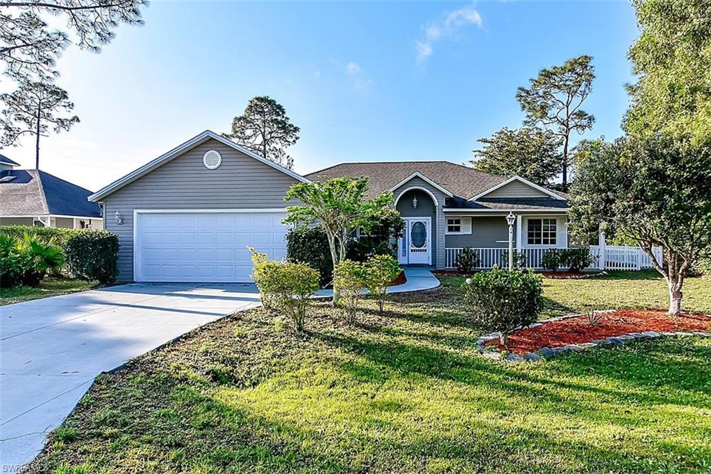 OLDE FLORIDA STYLE CHARMER! Charming and inviting Florida Postcard Style home in great neighborhood with large front porch and hard to find huge FENCED IN YARD!! Features of this home include newer appliances, tile and engineered wood though-out, split bedroom floor plan, wonderfully spacious master bedroom with sitting area and custom walk in closet; great sized guest bedrooms, high ceilings, big kitchen, crown moulding, large lanai and desirable open floor plan. This home is located in highly sought after community of Bonita Springs Golf & Country Club with super low fee of 190/year and centrally located in Bonita Springs close to shopping, dining, beaches and everything SWFL has to offer! CALL FOR YOUR PRIVATE SHOWING TODAY!!!