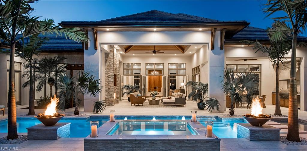 Gracious, Architecturally Inspired British West Indies smart estate in the heart of Pelican Bay! Every detail of this masterfully built, open concept floor plan home (4 BR+ office, 5 full and 1 half bath, 3 car garage) will impress you. Stunning stone entry columns flank a pair of 12' stained double entry doors, leading to a beautiful Entry and Great Room. The Great Room's large, floor to ceiling transom windows, soaring ceilings, beautiful and extensive trim detail, and wide plank washed oak floors are perfectly finished. Tastefully appointed chef's kitchen, complete with custom cabinetry, huge center island, wet bar, and fully appointed butler's pantry. The Master suite delivers on every level: spacious, gorgeous, and private, you simply must see it to appreciate. Three ensuite guest suites offer luxurious accommodations for family/friends. After all that, perhaps this homes crowning achievement is the Outdoor Great Room, complete with outdoor kitchen, stone fireplace, resort style southern exposure pool/spa flanked by twin fire bowls, and spacious, lushly landscaped, private full fenced backyard. No detail overlooked.