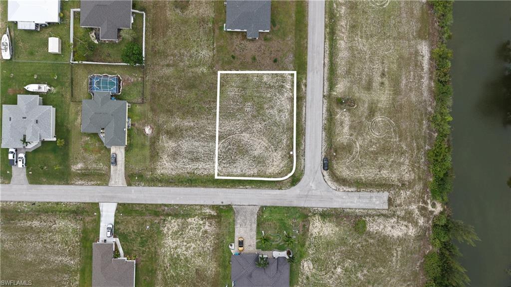 Excellent opportunity to own a 0.26 acre residential vacant lot in Cape Coral, FL, PID 35-43-23-C2-02755-0010. Located in the rapidly growing Northwest Cape Coral area, this property offers the perfect setting to build your dream home or invest in one of Southwest Florida’s most desirable markets. Enjoy convenient access to shopping, dining, schools, parks, golf courses, boat ramps, and world-famous Gulf Coast beaches. Public water service is available through the City of Cape Coral. Sewer service in this area is typically provided by a septic system unless and until municipal sewer expansion reaches the property. Electric service is available nearby. Buyers should verify utility availability, assessments, and connection requirements with the City of Cape Coral and Lee County.