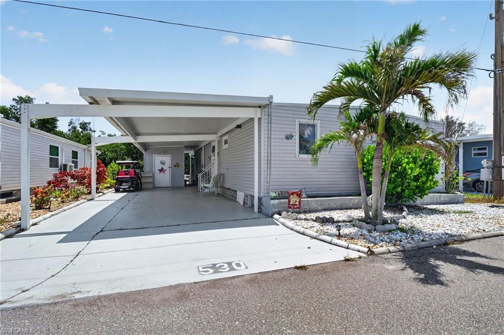 Are you ready to relax on your deck, cast a fishing line or maybe jump into your boat and go out to dinner?  If so, this home is for you! Seriously, take a look at this waterfront home in Old Bridge Village on a canal leading out to the Caloosahatchee River (without bridges) and your backyard view is of the water and mangroves, simply beautiful.  Let’s break tradition and talk about living in Old Bridge Village for a moment.  It is truly a Resort Community!  We are a 220 Acre Gated Waterfront Manufactured Home Community with a Marina, a Gorgeous New Pool and Spa! Tiki Huts!! A Private 8 Acre Waterfront Park with a Pier that overlooks the Caloosahatchee River for Fishing, Picnicking, Watching Sunsets or hanging out while making new friends.  Old Bridge Village provides an array of amenities, including an 81-slip Marina with a Boat Ramp, a Kayak Launch and a 24/7 Staffed Security Gate.  Enjoy shoreline fishing along the Caloosahatchee or indulge in recreational activities like Pickle ball and Tennis, even Horseshoes! Annual entertainment options hosted by the Yacht Club include events like the Commodores Ball, Boat to Lunch outings, and Shipwreck Parties. The Social Alliance hosts Potluck Dinners with Entertainment, Ice Cream Socials, Cards, Bingo and Holiday Dinners and an array of Recognized Entertainers. When you crave urban amenities, downtown Ft. Myers is just minutes away, offering many dining, theater, and shopping experiences. Discover endless opportunities for leisure and laughter in this vibrant community. Your gateway to the ultimate Florida lifestyle awaits at Old Bridge Village. Lastly, Old Bridge Village has VERY DESIRABLE HOA FEES. Live the Dream!

NOW THE HOME!!! AND WHAT A HOME IT IS!!!   This Two Bedroom, 2 Bath Home has a HUGE Living Room, Dining Room, LARGE KITCHEN WITH A BREAKFAST BAR WITH LOTS OF CABINETRY AND WORK SPACE.  The Living Room is Large and Open and Overlooks the Water, the Dining Area is large enough to seat 8 friends. There is an Office Area off the Dining Area.  The Owners Suite is large and can easily handle King Sized furniture and has an attached Bath with Step-in Shower.  It also has a very large Closet Space, including a cabinet with a drop-down ironing board. The Guest room is just as nice!  It can handle Queen Sized Furniture easily. The Main Bath is located across the hallway from the second bedroom. The Laundry is located inside the home which is a great step saving feature.  No complaints about cabinet/storage space in this home either!  Storage Galore! Whether you are looking for a Full Time Florida Residence or maybe a Winter Getaway, you will never find a Better Buy than this Home!  Please Look at All the Photos (and the Video, too) Old Bridge Village is Simply Amazing!  Call to See this Home TODAY!