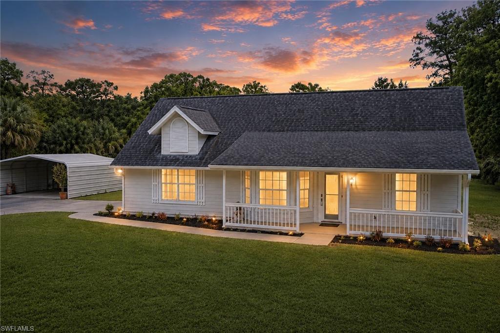 One or more photo(s) has been virtually staged, AI generated or rendered.  Luxury, privacy, and exceptional craftsmanship define this beautifully renovated 2.5-acre estate in Golden Gate Estates. Completely remodeled with fully permitted improvements, this move-in ready pool home offers a rare combination of timeless design, premium finishes, and modern updates. Ideally located west of Wilson Blvd., you'll enjoy peaceful estate living just minutes from Immokalee Road, Vanderbilt Beach Road, shopping, dining, and everyday conveniences, all with NO flood insurance required. 

From the moment you step inside, the quality is unmistakable. Soaring vaulted ceilings, a wood-burning fireplace, true porcelain tile flooring throughout, and solid-core interior doors create a warm, sophisticated living space that feels both refined and inviting. Every detail of the renovation was thoughtfully executed with an emphasis on craftsmanship, durability, and timeless style.  

The custom-designed kitchen is the centerpiece of the home, showcasing handcrafted birch and white oak soft-close cabinetry, a farmhouse sink, premium fixtures, a pot filler, brand new Kitchen-Aid appliances, and an open layout that flows effortlessly into the main living areas. Designed for both everyday living and entertaining, it's a space where beauty and function come together seamlessly. 

The primary suite offers a true spa-like retreat, featuring an oversized 4-by-8-foot walk-in shower and premium Moen fixtures that continue throughout the home. Every finish was selected to create a sense of comfort, quality, and understated luxury. 

Outside, the screened pool enclosure provides the perfect setting for relaxing or entertaining year-round. Mature vegetation along the front of the property creates exceptional privacy, while the cleared backyard offers endless flexibility for recreation, gardening, additional outdoor amenities, or simply enjoying the open space. The fully fenced 2.5-acre homesite also includes an attached two-car garage and a permitted covered carport, providing abundant room for vehicles, boats, trailers, and recreational equipment. 

Beyond the stunning cosmetic renovation, the home offers the confidence of extensive recent improvements, including Hardie Board siding, a 2019 roof, a 2018 A/C system, a 2024 water heater, and an updated electrical panel completed in 2026. Every major investment has already been made, allowing the next owner to simply move in and enjoy.