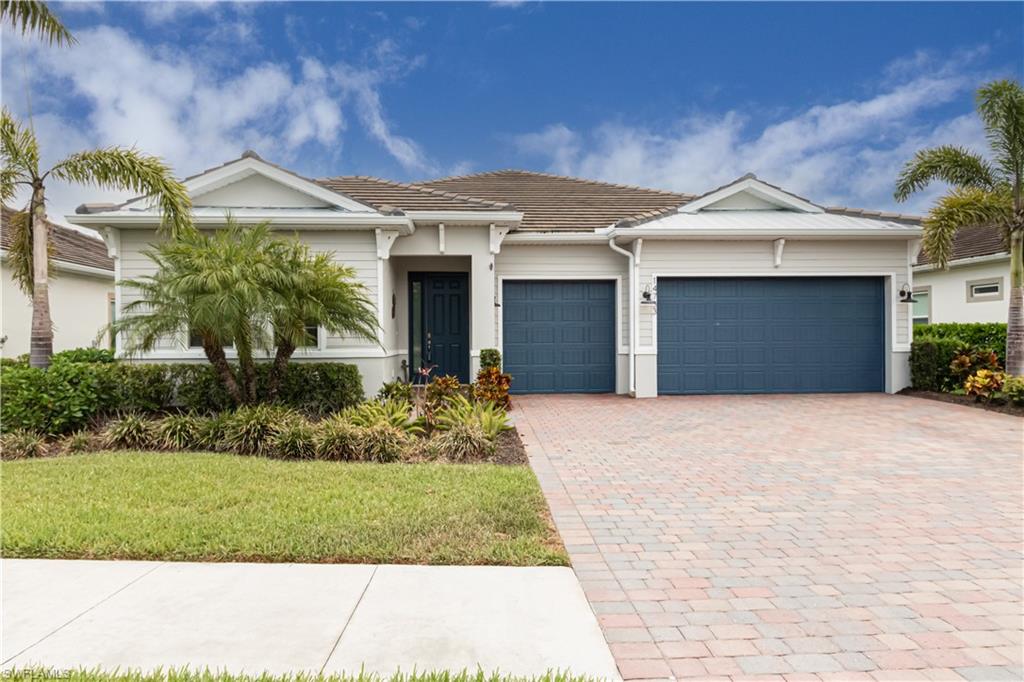 Do not miss this Rarely Available & Move in Ready Abbey Floor Plan Home featuring 3 Large Bedrooms + Den, 2 1/2 baths with All the Bells and Whistles!  Truly an Entertainer's Paradise, this Spacious Open Floorplan Home boasts Tile throughout main living area, Gourmet Chef's Kitchen w/Gas Stove, SS appliances, Soft Close Drawers, Pot/Pan Pull Out Drawer & Walk In Pantry.  The Master Bedroom offers a Gorgeous Walk in shower and dual walk in closets. More custom features: 1000 Gallon Propane Tank, Whole House Generator, 3 Car Air Conditioned Garage, 50 Gallon Commercial Hot Water Heater, Exceptional Custom Outdoor Kitchen with Sink, Icemaker, 2 Pull Out Cooler Drawers for your favorite drinks, Dual Burners & Trash Bins, Built in Grill w/Exhaust Hood &  under grill Storage. Relax on the Oversized Paver Deck Lanai with Heated Salt Water Pool and Spa, in your own Private setting.  Don't forget the Custom Commercial Grade Exterior Landscape Lighting to set the Evening Mood of Paradise Found!  Wait, there's more...Located in highly sought after Naples Reserve which includes a BEACH, FIRE PITS, Paddle Boats, Restaurant/CAFE, TIKI bar, Lap and Resort pool, Pickle Ball and so much more.