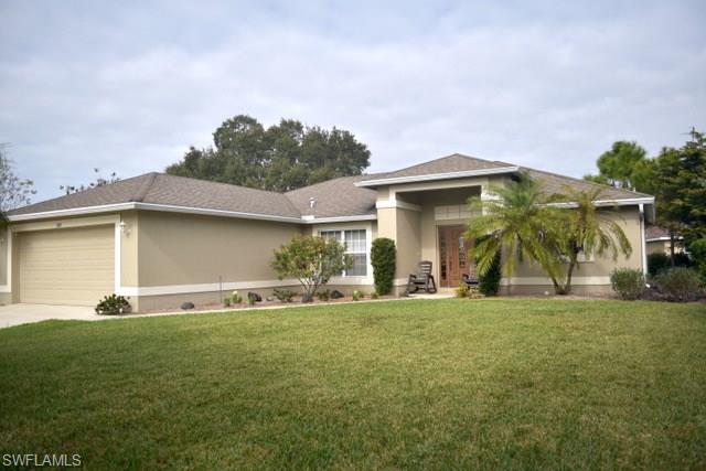 A charming split floor plan home that exhibits an abundance of "TLC".  Beautifully landscaped yard includes many native trees & shrubs and an irrigation system.  This home is a must see!  The Master on-suite bathroom has lots of room with a walk-in shower and a large linen closet.  Master Suite walk-in closet is a Ladies dream come true along with a second closet for the Spouse!  Great room includes a formal dining area, breakfast nook and 2 pantries.  (All Appliances Convey.)  Great Room opens out onto a screened lanai under truss.  Great room, Master Suite, Guest Bathroom & Laundry Room are tiled.  Laundry room is indoors with access to a 2 car garage with automatic door opener and storage cabinets.  Property has well water and septic.  Central Air & Heat - maintained by a professional AC company.  Well Pressure Tank replaced 01/2017.  New hot water heater & well pump - Replaced 12/2015.  Septic Tank pumped in 2014.  Hurricane Panels convey.  New Garbage Disposal installed 01/2017.