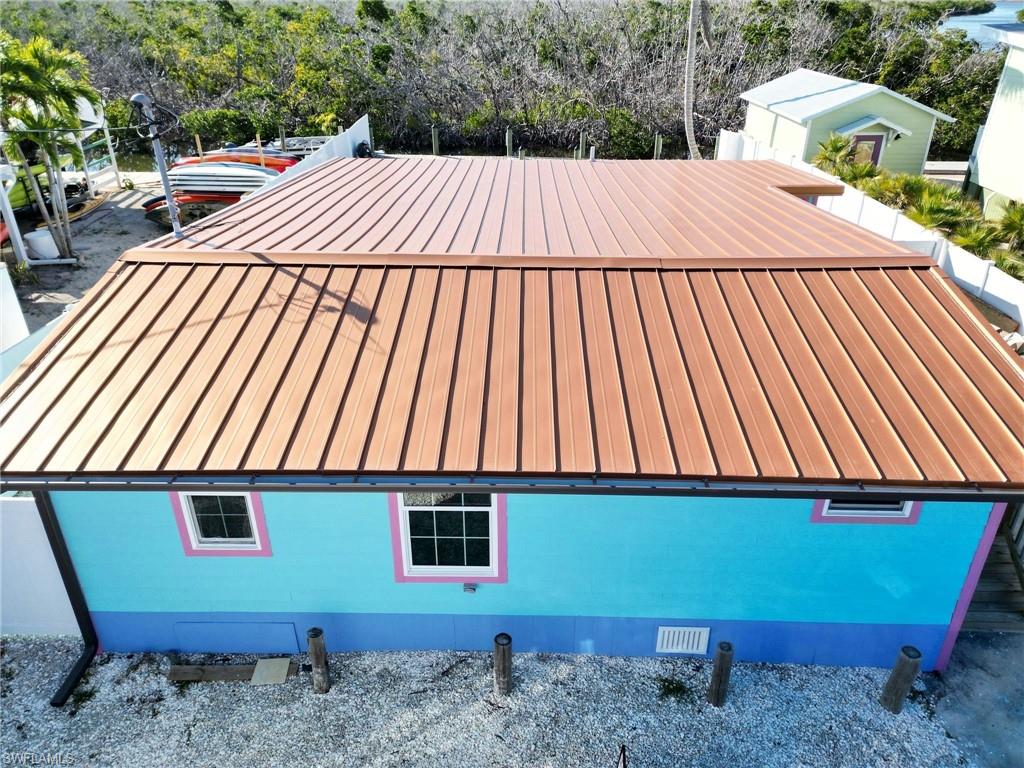 TRIPLEX already generating income! Welcome to your dream waterfront escape in Matlacha, a unique TRIPLEX boasting not only direct Gulf access but also a wealth of investment potential. 
This multi-family residence showcases 3 immaculate units. Each of them it's been meticulously renovated to offer comfort, style and functionality with brand new floors, new kitchen cabinets, appliances and a shared laundry room.
The setup is perfect for those looking to live in one unit while embracing the financial benefits of renting out the other two, providing a smart way to manage retirement finances while enjoying the culture and community of a bustling waterfront locale. 
Step outside to discover the vinyl fence surrounding the premises and a solid metal roof for your peace of mind.  Whether your passion lies in kayaking, world-class fishing, or simply soaking in the sun, this property has direct access to the Gulf via Matlacha Pass. The wooden deck is the perfect spot for catching snooks or indulging in the quiet joy of sipping the morning coffee. 
Your new income property is situated a leisurely stroll away from Matlacha community Park and directly across from the delightful Yucatan Waterfront Bar and Grill, perfect for evenings when cooking feels like too much of a chore. Not to mention, the nearby Publix Super Market ensures that all your daily needs are just a short drive away. 
Whether you are looking to enhance your lifestyle or expand your portfolio, this income property promises a blend of leisure and fiscal wisdom you won’t want to miss. Dive into this opportunity and let your investments dreams set sail in historic Matlacha!