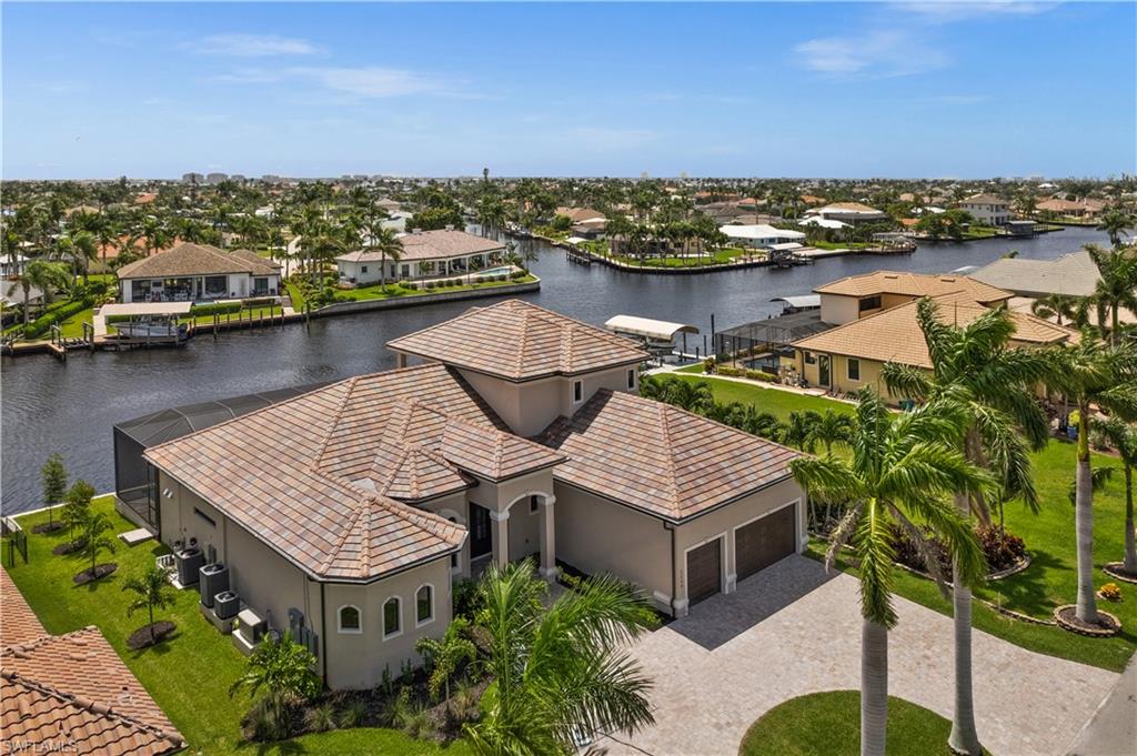 Welcome to your direct Gulf Access paradise! This exquisite custom-built home awaits, nestled along the majestic Bimini Canal. Just a brief boat ride to the Gulf of Mexico, restaurants, and beaches.This 4-
bedroom, 4.5-bath retreat with a library comes exquisitely furnished. The chef's dream kitchen
features quartz countertops, handcrafted cabinets, a gas range, and stainless appliances. 
An elevator grants access to the second-story in-law suite, featuring a separate living area, spacious bedroom, private bath, and balcony. Capture stunning sunsets from the 3rd-story lookout tower accessed by a graceful
spiral staircase. Your private oasis awaits outside, complete with a saltwater pool, spa, fire/water
bowls, and an outdoor kitchen with southeastern exposure. Designed for safety, the home offers
hurricane protection, impact windows/doors, electric storm shades, a 10’ custom iron front door,
a whole-house generator, a fire sprinkler system, attic storage, and a hidden safe room. The 3-car air-conditioned garage provides ample space, and the expansive 92 x 29 dock will include a lift and tiki hut. No expense has been spared in creating this exceptional home.