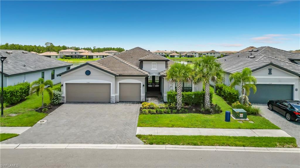 Welcome to this beautifully appointed single-story pool home in the highly desirable gated community of Timber Creek. Designed for both comfort and entertaining, this residence features an open-concept layout with elegant tile flooring throughout and soaring ceilings that create a bright, spacious feel.
The gourmet kitchen is equipped with quartz countertops, stainless steel appliances, wood cabinetry with 42-inch upper cabinets, and ample storage space. 

Step outside to your private backyard retreat featuring a sparkling pool, expansive screened lanai, and tranquil preserve views with generous green space and water  views, offering exceptional privacy and a true Florida lifestyle. With an oversized three-car garage. Includes designer furniture.

Residents of Timber Creek enjoy an impressive array of resort-style amenities centered around a 17,000-square-foot clubhouse, including a restaurant and bar & grill, fitness center, CrossFit room, dry sauna, indoor basketball and volleyball courts, pickleball, video arcade, and coffee bar. Outdoor amenities include a resort-style pool, dedicated lap pool, spa, tennis courts, pickleball courts, basketball courts, sand volleyball, bocce courts, and a full calendar of social activities.

Conveniently located near Southwest Florida International Airport, Gulf Coast Town Center, and the Boston Red Sox Spring Training Facility, this exceptional home offers luxury, convenience, and resort-style living at its finest.