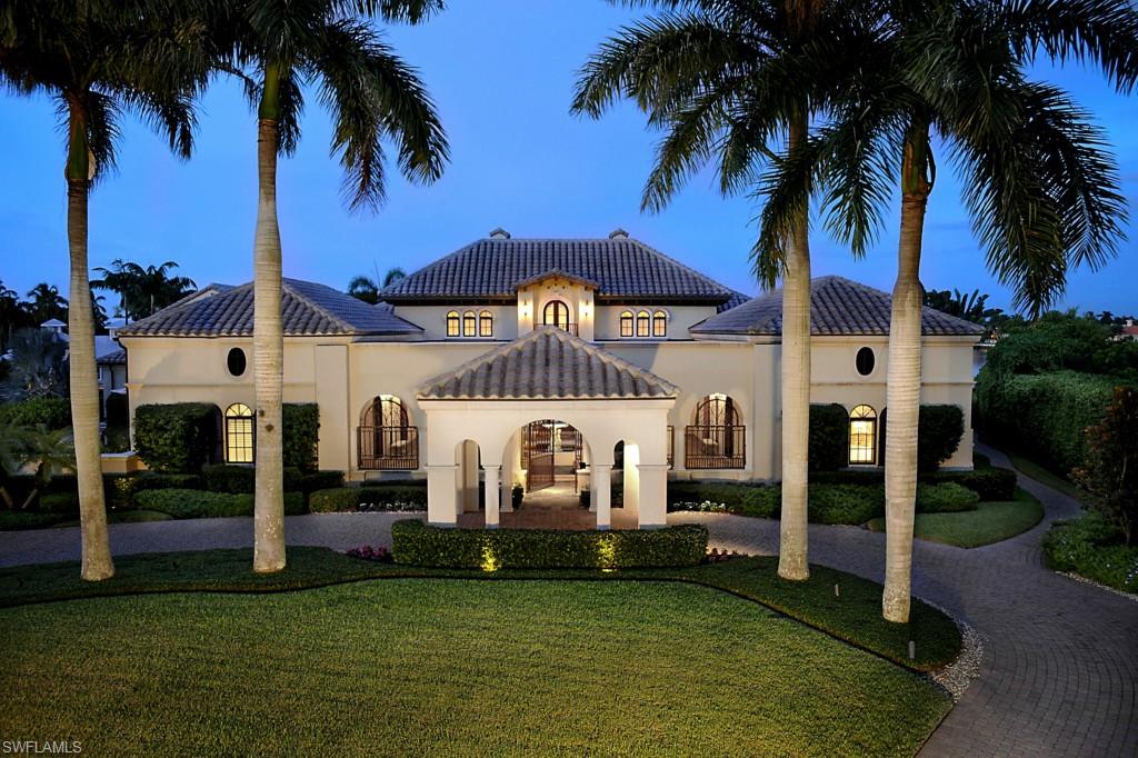 The Spanish Galleon - A sprawling lot and a half estate with panoramic views up and down Naples Bay.  Over an acre with 207' of waterfront. Timelessly finished with Teak beams, trusses, floors, and  Mahogany wood doors throughout.  The great room floor plan captures the essence of bay front living with 5 bedrooms, 7 baths, and upgraded features. A spacious Master suite and 3 of the guest suites with separate entrances are on the 1st floor along with the teak trimmed study. The chef's kitchen boasts double ovens, SubZero refrigerators, freezers, drawers, as well as wine storage and Miele espresso machine in the butler's pantry. A 45KW stand by generator and hurricane impact glass provide peace of mind. The million dollar boat house is unique to this property with a 76,000 lb. lift system and a/c. This property immediately qualifies for Port Royal Club membership eligibility.