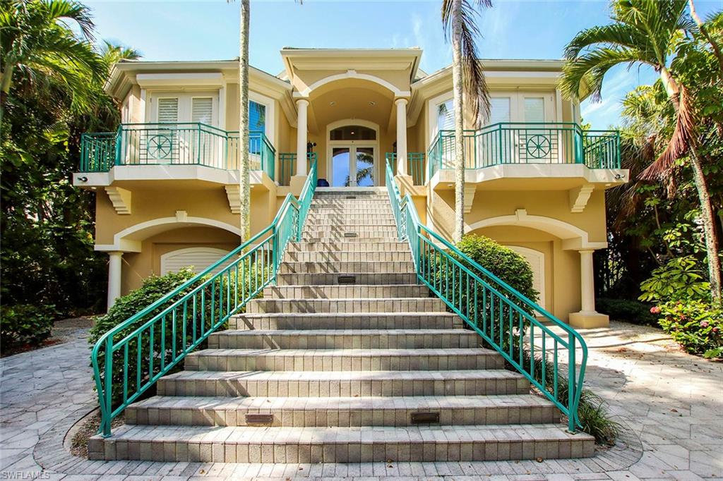 Stunning beach home located on over 1 acre in the small private neighborhood of Seaspray. This casually, elegant home features an entire floor dedicated to the master suite with fireplace, spacious marble bath, private outdoor deck and access to the upper sundeck.  Every floor is easily accessed by 3 story elevator and stunning staircase.  
Main level features large open kitchen and living area with gorgeous views of the tropical landscaping and the turquoise blue waters of the Gulf of Mexico.  Two guest bedrooms with a shared bath, laundry, powder room, office/den are also conveniently located on the main living level. Gulfside pool and spa make you feel you are relaxing at your own tropical resort. Soaring ceilings, impact glass, two gas fireplaces, marble flooring, built in custom cabinetry, solid wood paneled doors, huge walk in closets, top of the line stainless appliances, roof top sundeck are just a few of the features that make 1304 Seaspray a magical home.