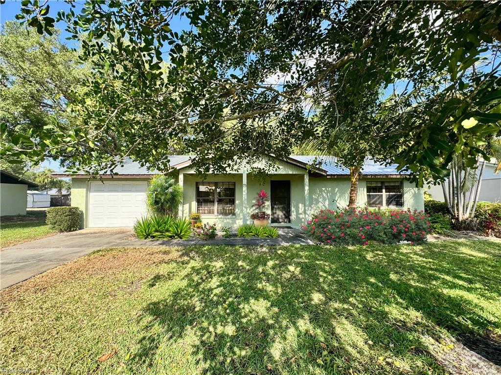 CUTE, CONVENIENT & CHARMING! You will not find a more convenient loaction in the city limits of Labelle, a short distance to Shops, Restaurants, Drs. and professional offices. A brand new metal roof will ease your mind for years down the road, along with making insurance easier on your wallet. Constructed of Concrete Block, this well maintained and comfortable home is solidly built and received no damage during any of our storm seasons. Stepping inside this charming home you will find an easy to love floor plan and generously sized rooms. The expansive screened porch along the entire back side of this home is a great space for gatherings and enjoying the beautiful and peaceful back yard. If you love watching birds there are plenty beautiful sightings here. A one car attached garage will keep you dry coming and going during the summer rains. Don't let this cute 2-bedroom home slip by. Do yourself a favor and schedule your showing now!