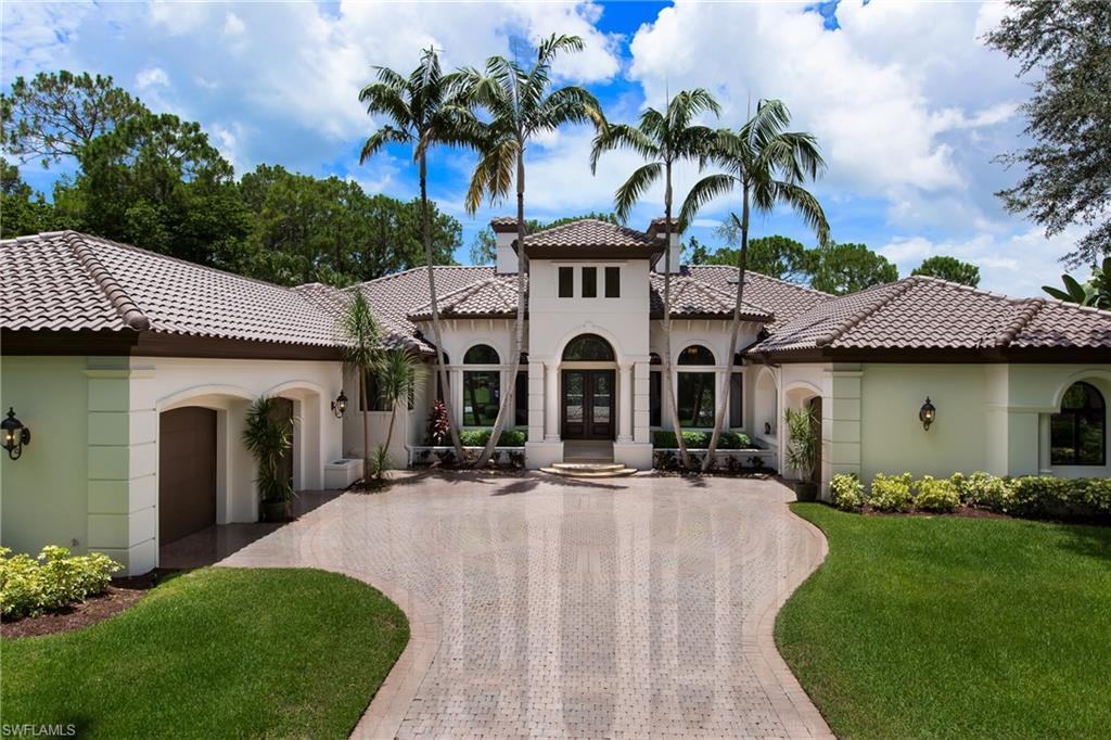 H.12094 – WOW! WOW! WOW! Gorgeous estate home has been totally redone both inside and out!  The transformation is unbelievable!!! You are greeted by the gracious living room with 2-story fireplace, formal dining room, and private office.  The butler’s pantry & wine room lead the way to the spacious Chef’s kitchen. The white kitchen is done with the most current look and finishes!!  Masterfully crafted and updated family room opens to covered lanai and summer kitchen.  3 freshly painted guest suites with new carpeting, celling fans & walk-ins. The Owners Wing is simply stunning which includes a separate sitting room, 2 large walk-ins and a spa-like bath that overlooks the garden water wall. There are so many places to enjoy outside as well.  Thoughtful design and spacious resort-size lanai, fountain and pool provides countless places to relax and soak up the sun. Freshly landscaped & painted outside make the curb appeal outstanding!  Split garages with epoxy flooring and custom built-ins provide additional storage as well. The amazing privacy of this SW exposure lot captures, the golf course view, glistening lake and preserve settings!! Don’t miss this opportunity to call this home!