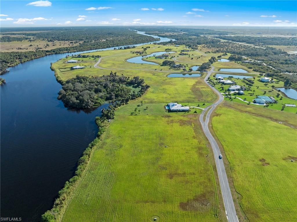 Riverside living at its finest!  Build your dream waterfront home on just over 1.5 acres in the exclusive, gated community of Caloosa Preserve. Nestled along the serene Caloosahatchee River in Alva, this private enclave features elegant executive homes on generous lots, offering both space and sophistication.
Enjoy direct access to the river and Gulf with community amenities that include a private boat ramp, dock, and gazebo—perfect for boating, fishing, or simply taking in the view. Forget crowded public ramps; here, your boat is always ready for the next adventure. Additionally, this lot is eligible for a private dock or boathouse to be built, with HOA approval. Dock your boat in your back yard! Ideally situated East of Fort Myers and Interstate 75, Caloosa Preserve offers quick access to local shopping and dining, the Caloosahatchee Regional Park, Hickory Creek Wildlife and Environmental Area and Manatee Park. You will also find optional memberships, including golfing at nearby River Hall Country Club and The Verandah Club. Welcome home!