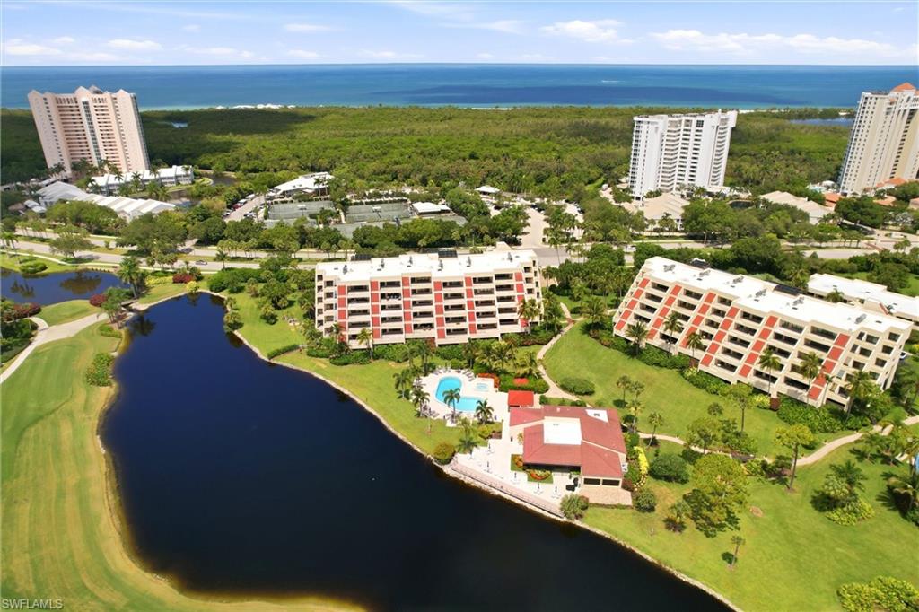 Experience refined coastal luxury in this spectacular, completely REMODELED residence in Hyde Park, one of Pelican Bay's most coveted communities. Perfectly positioned to capture tranquil eastern sunrises and SWEEPING LAKE AND GOLF COURSE VIEWS, this exceptional two-bedroom plus den, two-and-a-half-bath condo with over 1600 sq ft under air  has been thoughtfully redesigned with timeless elegance and uncompromising attention to detail.

Every element of the residence has been carefully curated, from the IMPACT-RESISTANCE WINDOWS AND DOORS to the exquisite custom cabinetry throughout. The GOURMET KITCHEN is a true showpiece, featuring premium JENN AIR APPLIANCES, dramatic QUARTZITE COUNTERTOPS, and a stunning matching quartzite dining table. Entertain effortlessly with the CUSTOM WET BAR complete with a dual-zone wine refrigerator, while HUNTER DOUGLAS remote-controlled dual shades and Vertiglide® door coverings provide both sophistication and convenience.

The spacious primary suite offers a luxurious retreat with a CUSTOM WALKIN CLOSET, dual vanities, and a beautifully designed walk-in shower. Additional features include a NEW HIGH EFFICIENCY VARIABLE SPEED AIR CONDITIONER , full-size washer and dryer, CUSTOM BEDROOM CLOSET in guest bedroom, and abundant storage throughout.

An expansive, nearly 500-square-foot terrace extends the living space outdoors, creating the perfect setting for morning coffee, evening cocktails, or year-round entertaining. A large enclosed storage room and an assigned UNDER BUILDING PARKING SPOT further enhance the home's convenience.

Ideally located directly across from The Commons, residents enjoy immediate access to Pelican Bay's tram service, providing effortless transportation to nearly three miles of pristine private beach and two exclusive beachfront restaurants.

Hyde Park has recently undergone extensive community enhancements, including NEW ROOFS , NEW EXTERIOR PAINT, and beautifully renovated clubhouse and fitness facilities, making this neighborhood one of Pelican Bay's most desirable addresses.

Pelican Bay is internationally recognized for its exceptional lifestyle, offering private beachfront access, TWO BEACHFRONT RESTAURANTS, a world-class community center with fitness and wellness facilities, two premier tennis complexes, scenic walking and biking paths, and opportunities for canoeing and kayaking. Optional membership at Club Pelican Bay provides access to 27 HOLES OF CHAMPIONSHIP GOLF.

Located just moments from Waterside Shops, Mercato, Whole Foods, Artis—Naples, and Naples' finest shopping, dining, and cultural destinations, this extraordinary residence represents a rare opportunity to enjoy the very best of luxury living in one of Southwest Florida's most prestigious communities.