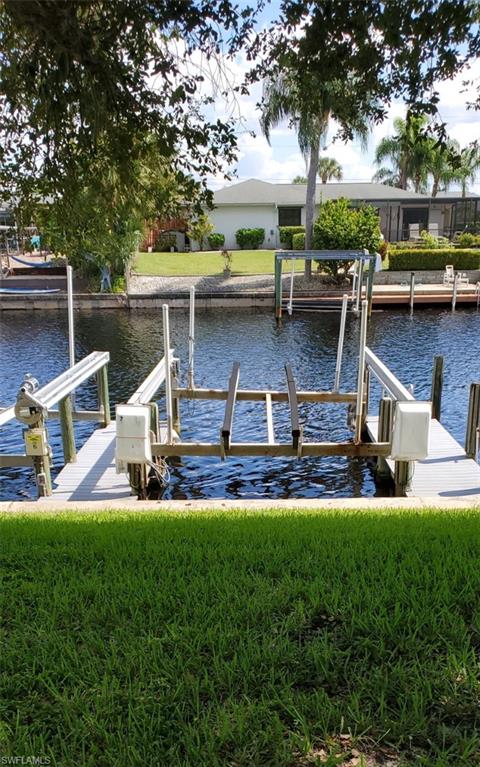 Completely renovated end unit 2 bedroom condo with its own 20 Foot boat slip and 10K lift which conveys with the unit. No bridges!! Tastefully furnished and ready for a new owner. Sit on your private balcony and watch the boats go by. Common area has tables and grills. Only 10 minutes to big water. 
All new stainless steel appliances, granite counters, beautiful ceiling fans and lights. The unit is freshly painted, has new hurricane impact windows and much more. Tile throughout the entire unit. 
The A/C is three years old and boat lift is six years old. 

This gorgeous condo is an end unit close to all shopping and restaurants. Come see it.