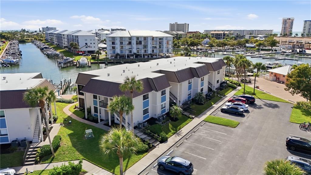 Available for Seasonal Rental – Waterfront Condo on Fort Myers Beach!
Live the Florida lifestyle in this beautifully remodeled 1-bedroom, 2-bath waterfront corner residence just steps from the white sandy beaches of Fort Myers Beach. Offering direct intersecting canal views, this second-floor end unit is filled with natural light and coastal charm. The thoughtfully updated interior features hurricane impact windows and doors, luxury vinyl flooring, quartz countertops, stainless steel appliances, plantation shutters, custom woodwork, decorator lighting, remodeled bathrooms with raised ceilings, and an in-unit washer and dryer(a rare convenience) in many beach condos. The enclosed lanai expands the living area, creating the perfect space to relax while watching boats, dolphins, and manatees pass by. The community pool overlooks the intersecting canal! This turnkey furnished residence comfortably accommodates guests with a sleeper sofa, two full bathrooms, and an open floor plan designed for easy coastal living. Enjoy being just a short walk to Fort Myers Beach, Santini Marina Plaza, Fish Tale Marina, waterfront restaurants, shopping, and entertainment. This unit is also for sale!