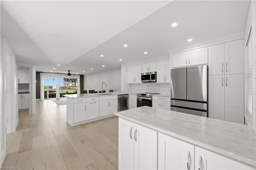 ANNUAL RENTAL FULLY REMODELED 3-BEDROOM CONDO IN NAPLES! This beautifully renovated first-floor end unit in Canterbury Village at Berkshire Village offers 3 bedrooms, 2 bathrooms, and approximately 1,350 square feet of thoughtfully designed living space. The luxury renovation includes wood-look Italian porcelain tile, upgraded doors and trim, modern baseboards, a stylish new kitchen, and completely redesigned bathrooms. The split-bedroom floor plan provides added privacy, while the walk-in closet, in-residence laundry, private patio, and assigned parking add everyday convenience. Residents enjoy access to community pools, tennis courts, walking areas, and a fishing pier. Ideally located near Berkshire Commons, Publix, Starbucks, restaurants, shopping, downtown Naples, and Southwest Florida's beautiful beaches.