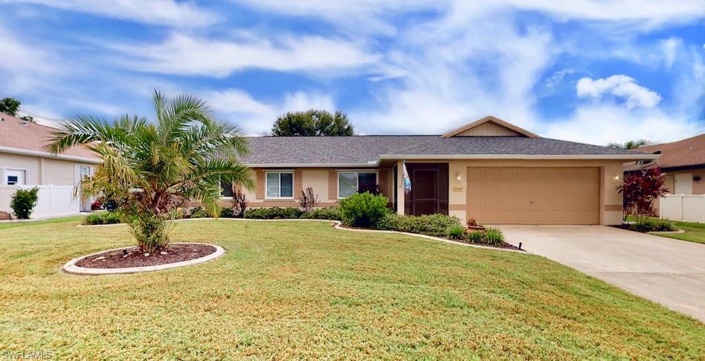 Fall in love with this fully updated MOVE IN READY home on a quiet cul-de-sac street in Deep Creek! Major updates include a NEW ROOF (2018), NEW WINDOWS WITH HURRICANE SHUTTERS, all new flooring throughout main living spaces and newer carpet in bedrooms. LOVINGLY MAINTAINED! Check out the spacious kitchen featuring Corian counter tops, real wood cabinetry and LARGE PANTRY! Kitchen is connected to the family room/bonus room with access to your screened lanai through FRENCH DOORS. Beautiful wood look plank laminate throughout main living areas with ceramic tile in kitchen & bathrooms (all very easy to keep clean). The bedrooms feature plush carpet. Well appointed master bathroom includes a tiled walk in shower and guest bathroom has a shower/tub. LARGE BACKYARD with private screened lanai and additional brick paver patio for extra space to play and entertain your family and friends! Quiet location on cul-de-sac street! Deep Creek is a single family home community with TOP RATED SCHOOLS and fast access to I-75. Put this house on your MUST SEE list today!
