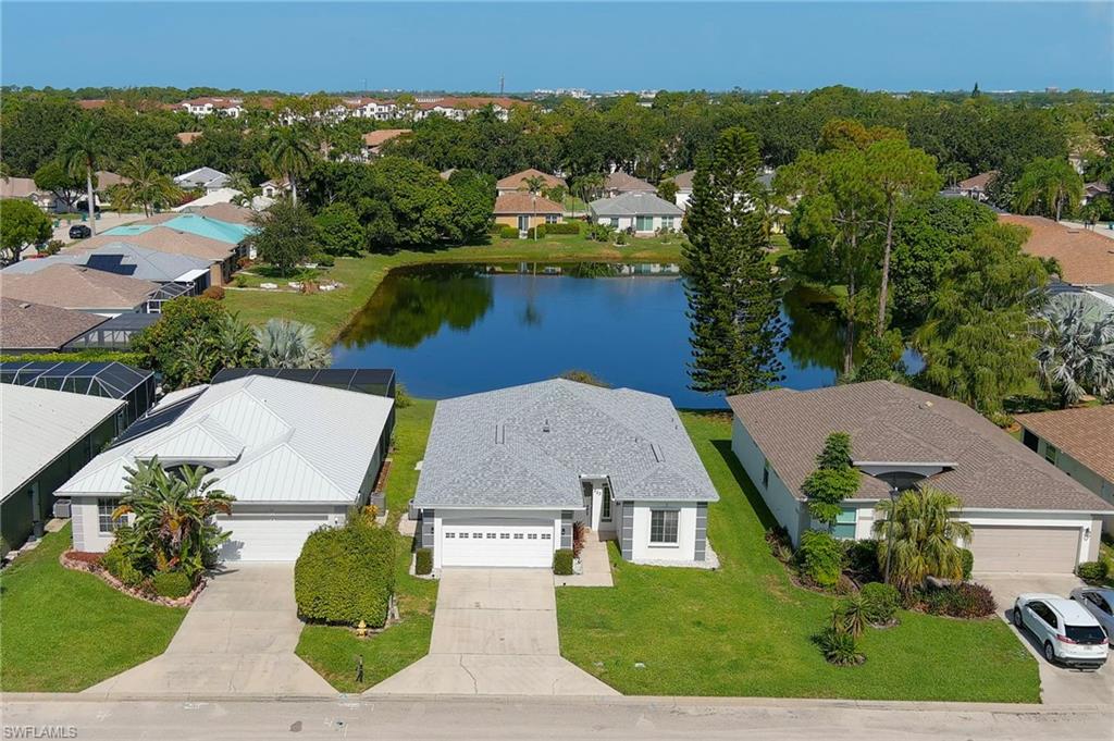 One or more photo(s) has been virtually staged, AI generated or rendered.  Beautifully updated 3-bedroom, 2-bathroom home in the desirable Maplewood community, set on a lake view lot with 1,500 sq. ft. under A/C for a total of 1,923 sq. ft., including the screened lanai. This concrete block home has been extensively refreshed, featuring new flooring throughout, fresh interior and exterior paint, brand-new granite countertops in the kitchen and both baths, updated washer/dryer and dishwasher, newer windows and HVAC system, and new landscaping. The flexible floor plan includes a primary suite with an en suite bath and a second bedroom with a built-in Murphy bed and closet — ideal for a home office or guest space. A double-car garage offers ample parking and storage. High-speed internet and cable are included in the rent, making this a truly move-in-ready home. Maplewood offers residents a community pool, recreational park, and well-maintained streets in a quiet, family-friendly setting — just minutes from Naples shopping, dining, and the Gulf Coast beaches. Conveniently located just under 15 minutes to Coastland Center Mall, Naples Zoo, Fifth Avenue's world-class dining and boutique shopping, 30 minutes to Southwest Florida International Airport, and a short drive to everything Southwest Florida has to offer.