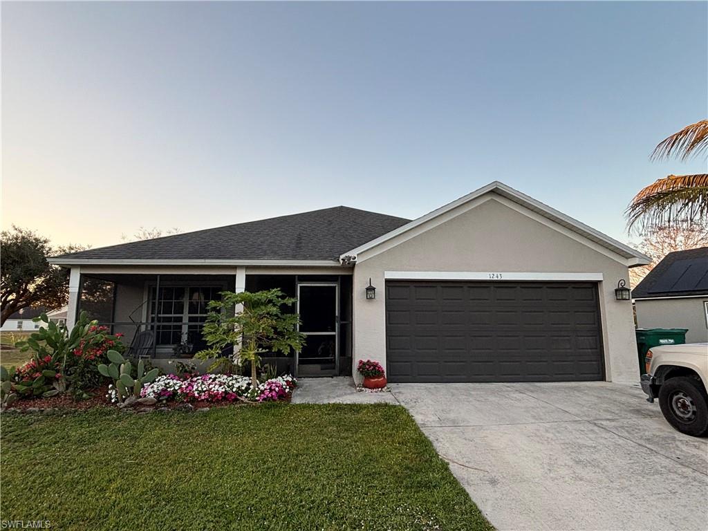 Well-maintained home located in Immokalee, FL, situated at the end of a quiet cul-de-sac. The property features a screened lanai overlooking the lake, offering a peaceful and private outdoor space. The lake view is enhanced by mature trees providing natural scenery and privacy.

The backyard includes an irrigation system, fruit trees such as papaya, coconut, and mango, as well as nopal cactus. A shaded area offers space for outdoor grilling and recreation.

Inside, the home offers an open floor plan that connects the kitchen, dining, and living areas, creating a spacious and functional layout. The kitchen is equipped with stainless steel appliances and includes a built-in workspace area.

A den with a double window and an additional side window provides ample natural light and can be used as an office or additional living space.

Additional features include a water purification system, new washer and dryer, and hurricane shutters on all doors and windows. The air conditioning system is approximately 2 years old, and the roof is approximately 7 years old.

The two-car garage also houses the air conditioning unit. Parking is approved for up to three additional vehicles in the front, with the option to install a concrete slab or pavers.

Community amenities include a playground, swimming pool, and ongoing security patrols. Low HOA fee.