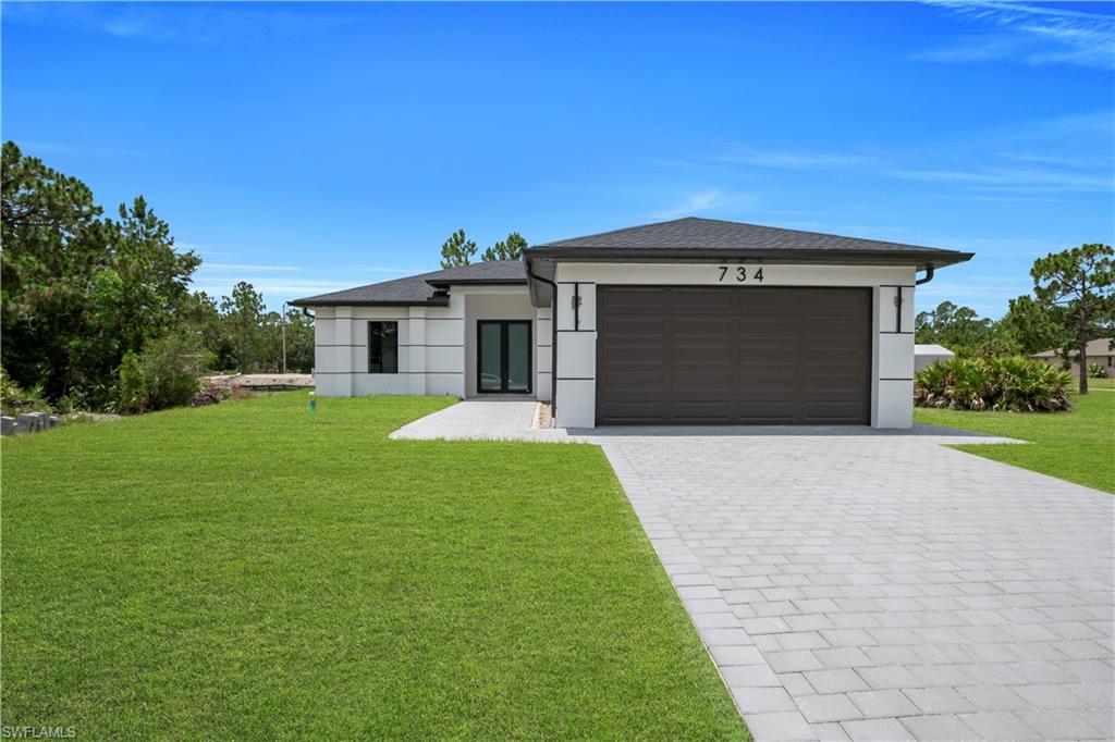 NEW CONSTRUCTION – MOVE-IN READY! Welcome to this beautifully designed 3-bedroom, 2-bathroom home featuring 1,314 sq. ft. of living area and a desirable split-bedroom floor plan. The open-concept layout offers a spacious living and dining area that flows seamlessly into the kitchen, creating an ideal space for everyday living and entertaining.

The primary suite provides privacy and comfort with a walk-in closet and en-suite bath. Additional features include tile flooring throughout, an indoor laundry area, a 2-car garage, and a covered lanai perfect for enjoying the Florida lifestyle.

Situated on a generously sized lot in a growing area of Lehigh Acres, this home offers convenient access to shopping, dining, schools, parks, and major roadways. No HOA fees and no community restrictions. Whether you are looking for a primary residence, seasonal home, or investment property, this new construction presents an excellent opportunity. Schedule your private showing today.
