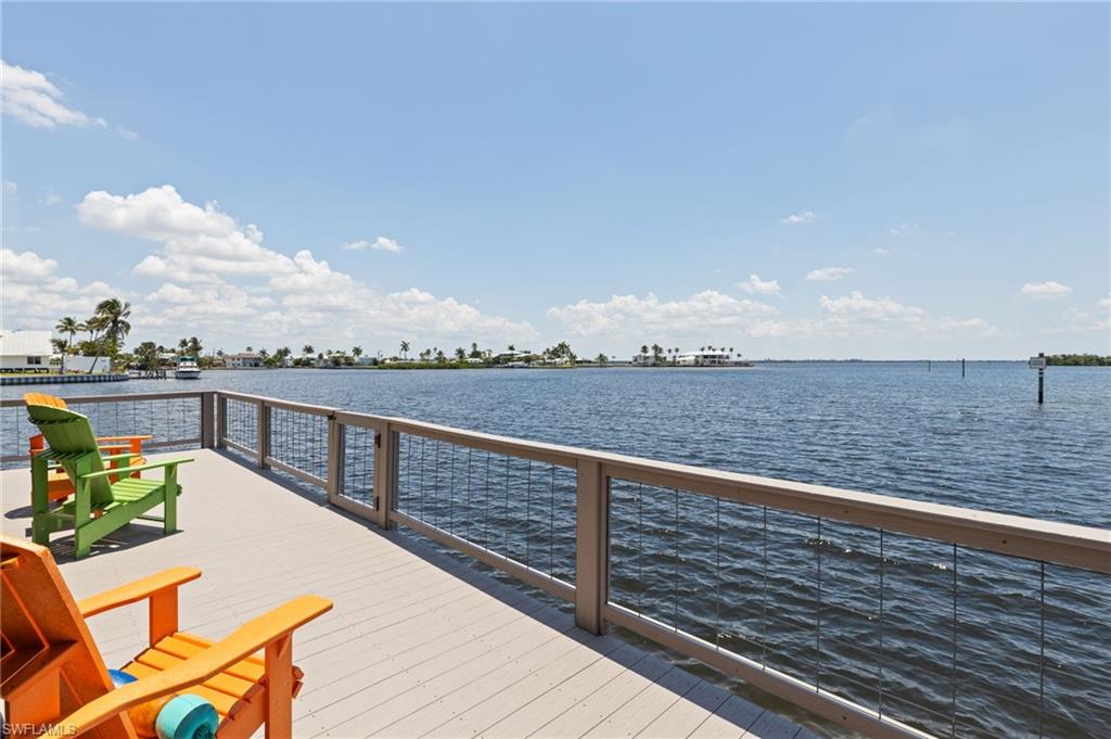 Wonderful seaside cottage with open water views! On any given day, take in the beautiful sunrise while drinking your coffee on the screened lanai. If you're lucky, you may watch dolphins feeding or otters at play. This is a fully renovated and restored property that proves the resiliency and spirit of this special little island. The home has superior wind protection with impact windows, doors, and metal roof----and suffered no known damage in Hurricanes Helene and Milton! Within walking distance of this cute cottage are restaurants, shops, and the community park with boat and kayak launches. This home must be seen; it's a jewel!