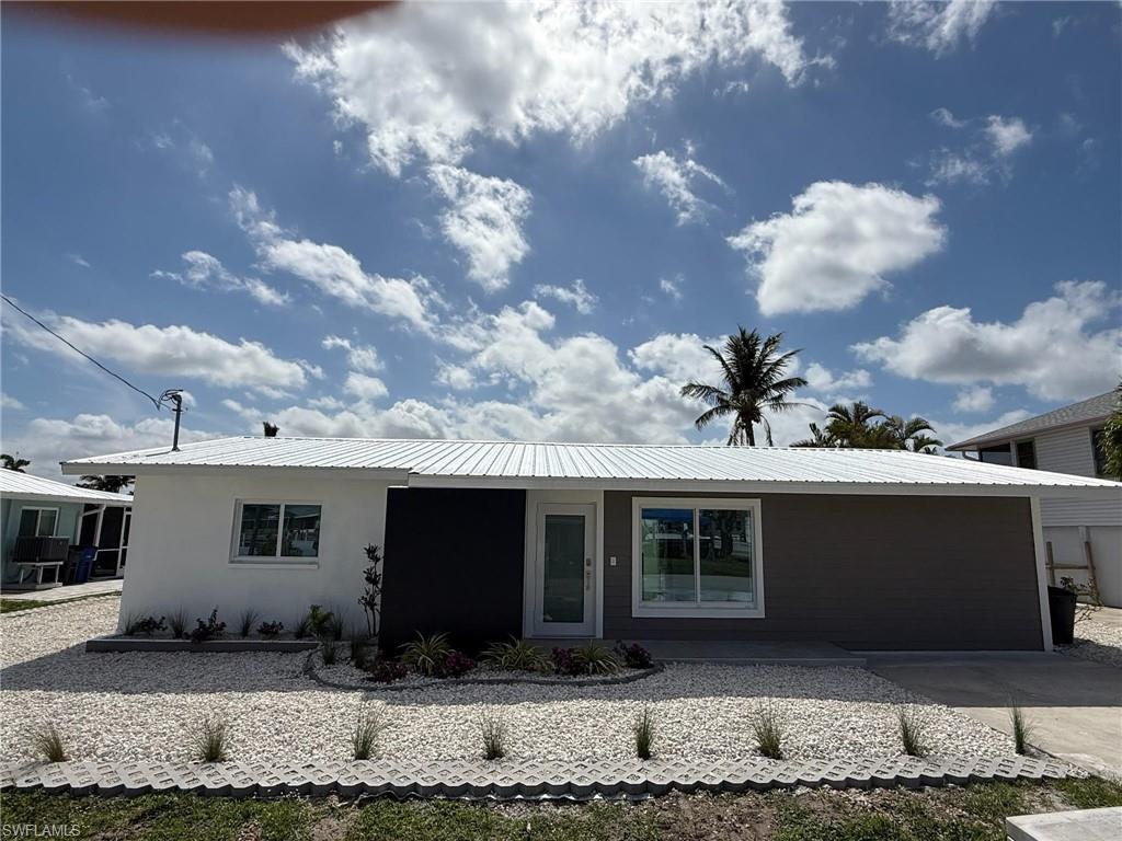 THIS RESIDENCE HAS BEEN REMODELED FROM THE SLAB TO THE ROOF! THREE MASTER SUITS!!! NEW INTERIOR: NEW DRYWALL / PAINTED AND TEXTURED, NEW KITCHEN CABINETS AND VANITIES, NEW QUARTZ COUNTER TOPS, NEW KITCHEN / BATH PLUMBING AND FIXTURES, SS FARM SINK, SS LG APPLIANCES: RANGE/CONVECTION OVEN, MICROWAVE, 25c/f REFRIGERATOR/W ICEMAKER, DISPOSAL, 2 LAZY SUSANS AND 6 DOOR PANTRY, FULL SIZE WASHER AND DRYER, HWH, ALL TILE BATHS WITH LIGHTED MIRRORS, FLOATED VANITIES, 3 CEILING FANS, NEW 200 AMP ELECTRIC SERVICE PANEL, NEW CENTRAL AIR / INSULATION IMPACT WINDOWS / DOORS, METAL ROOF, PAINTED STUCCO EXTERIOR, NEW LANDSCAPING AND RIVER ROCK, COMPOSITE DOCL WITH 10k LB. BOAT LIFT / H2O/ELECTRIC @ DOCK, LOCATION! LOCATION! LOCATION! 5 minutes for 2 Publix shopping centers with gas, banks, restaurants, shops, ride your bike or take your boat to the shops and restaurants of Matlacha, NO HOA FEES! MINUTES TO THE BEACHES SANIBEL AND BOCA GRANDE TARPON WATERS! NO ISSUES WITH LOW TIDE WATER LEVELS, BEST VALUE ON THE WATER!!!