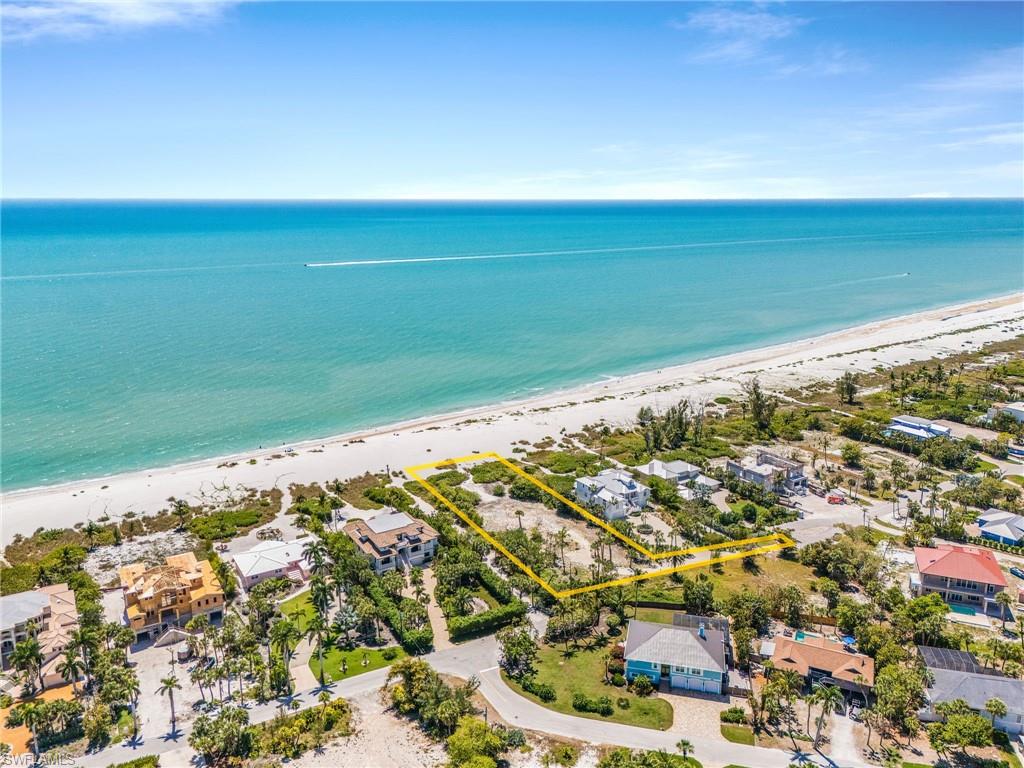 Nestled along the majestic shoreline on Sanibel, this beautiful beachfront lot is located at the end of a quiet cul-de-sac in the desirable Chateaux Sur Mer community.  The generous size lot with 105' of direct gulf frontage and 66,415 total sq ft provides the opportunity to build your gulf front island dream home!  Impervious allowable coverage is 25% of parcel totaling 16,604 sq ft and developed allowable coverage is 30% of parcel totaling 19,924 sq ft.  Seller has home plans available including DEP permitting in place through 11/2026 with Benchmark General Contractors, landscaping designs through Coastal Vista Design and continues to maintain water utilities & landscaping making this property poised and ready to begin building your own piece of island paradise!