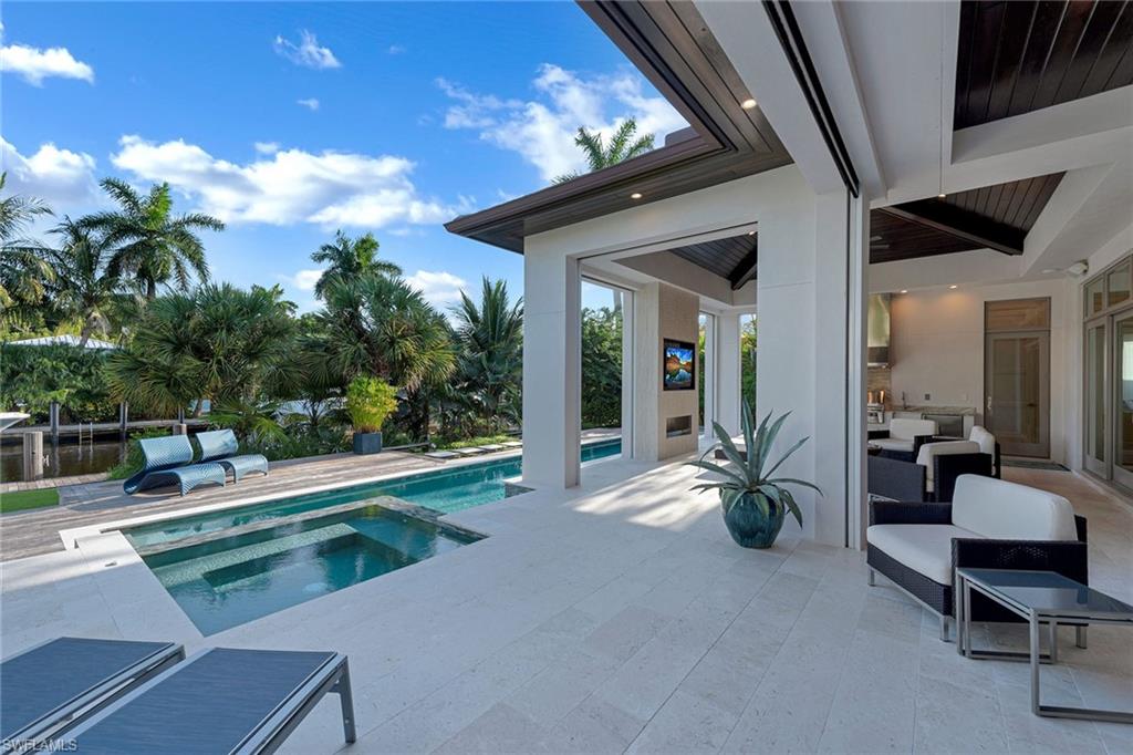Relaxation is yours as you step into a custom home by Falcon Design/KKG in prestigious Aqualane Shores. Luxurious living with 5 bedrooms, home automation, 1GB fiber internet, 3-car garage, pool/spa & Koi pond. Bedrooms have en-suite baths with the 3rd & 4th bedroom connecting to the family room with wet bar & refrigerator. The 3rd bedroom features a balcony overlooking the tranquil outdoors with a private entrance allowing for a completely independent 2-bedroom guest suite on the 2nd level. The master retreat features a contemporary walk-in shower, quaint outdoor shower, dual sinks & a vast walk-in closet. Modern design & décor, floor-to-ceiling windows, 1,000-bottle climate-controlled wine room, Ruffino cabinetry, Vantage lighting system, Lutron shade system, natural gas & home generator. The expansive outdoor living area is elegantly accented with Cypress wood ceilings & protected by electric screens & hurricane shutters & includes a full outdoor kitchen, outdoor fireplace & shell stone pavers. Residence is finished with IPE dock with 4,500lb & 27,000lb boat lifts. Located close to 3rd Street South & minutes to 5th Avenue’s fine dining, world-class shopping & white-sand beaches.