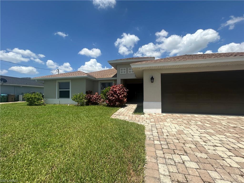Welcome to your new home! This spacious and modern residence boasts over 1650 square feet of living space, complete with high-quality finishes and thoughtful details throughout.

As you step inside, you'll notice the sleek tile flooring that runs throughout the common areas, adding a touch of sophistication to the space. The bedrooms are cozy and comfortable, with plush carpeting underfoot for added warmth and comfort.

The heart of the home is the stunning kitchen, which features all-wood cabinets, gleaming granite countertops, and top-of-the-line stainless steel appliances. The convenient bar top seating is perfect for entertaining guests or enjoying a quick meal on the go. Just off the kitchen, you'll find a spacious dining area that's ideal for hosting dinner parties or family gatherings.

The primary bedroom is a true oasis, with a large walk-in closet and an oversized bathroom that's perfect for unwinding after a long day. Relax in the corner soaking tub or enjoy the separate his-and-her vanities that offer plenty of storage space. You'll also love the convenience of the large walk-in closet that keeps everything organized and easily accessible.

Additional features of this home include an inside laundry area with washer & dryer, a 2-car garage that provides ample storage space, and a large screened-in back lanai that's perfect for enjoying the beautiful Florida weather. 

Don't miss your chance to call this stunning home yours and experience all the luxury and comfort it has to offer!

NO POOL/NO HOA/ Small pet 45 lbs. or under considered with non refundable fees