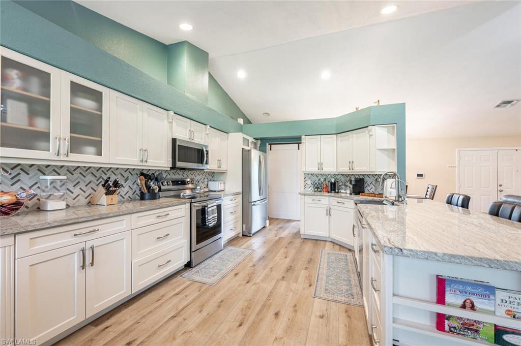 Welcome to this beautifully updated home featuring a highly desirable layout and stylish finishes throughout. The kitchen showcases rich wood cabinetry, soft-close cabinets, level 5 granite countertops, and a reverse osmosis water system. Flooring includes elegant tile and luxury vinyl plank, creating both durability and style. Impact windows, doors, and sliding glass doors provide peace of mind, while the roof was replaced in 2018. Bathrooms have been tastefully remodeled, and the spacious primary suite includes a large walk-in closet. Additional upgrades include an updated sprinkler system, a recently blacktopped driveway with rock turnaround, a garage with epoxy flooring, and a shed for extra storage.

This prime location offers the best of both worlds — estate-style living with privacy and space, plus the convenience of the rapidly expanding Immokalee Rd & Oil Well corridor, where exciting new businesses, restaurants, and a brand-new Publix are coming soon. With excellent schools nearby, this home offers comfort, convenience, and strong future value.