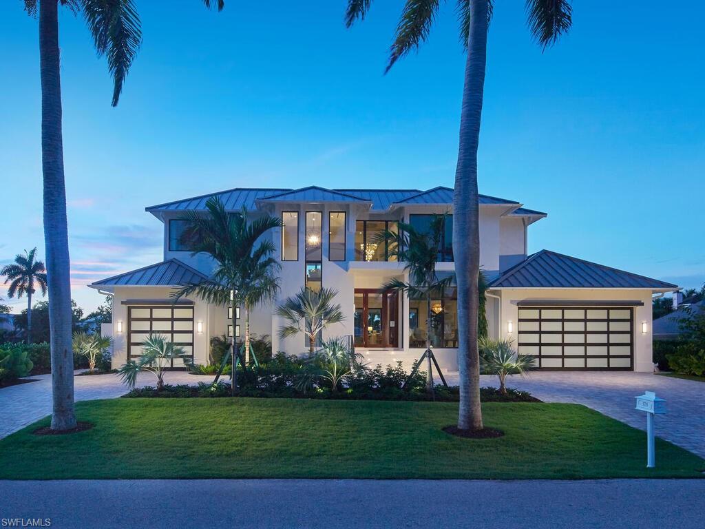 A Home That Defines Naples Living! Nestled in one of Naples’ most coveted waterfront enclaves, this architecturally stunning residence by Stofft Cooney and constructed by Waterside Builders redefines coastal contemporary elegance. Spanning an impressive 8,000 square feet, this amenity-rich retreat effortlessly combines sophistication with the comforts of an intimate luxury lifestyle. Every inch of this thoughtfully designed home has been curated to cater to families, entertainers, and discerning investors seeking a property that embodies both form and function. Upon arrival, the grand entrance opens to an inviting floor plan bathed in natural light, where neutral hues and artful accents create a serene yet striking ambiance. The open-concept kitchen, equipped with state-of-the-art Sub-Zero, Wolf, and Cove appliances, is a culinary enthusiast’s dream. The adjoining breakfast nook is perfect for morning gatherings, while the seamless flow to the dining and living areas makes hosting elegant soirées a breeze. For moments of quiet refinement, the adjacent Club Room offers an intimate setting for poolside conversations or evening relaxation, blending polished sophistication with warm comfort. The outdoor living space, with its shimmering pool and waterfront views, invites al fresco dining and memorable gatherings under the stars. The private owner's suite on the main level is a sanctuary of tranquility, featuring two oversized walk-in closets and a spa-inspired bath flooded with natural light. Upstairs, a spacious lounge leads to three en-suite guest bedrooms, each a haven of privacy and comfort. The pièce de résistance is a second owner’s suite, complete with a private balcony offering breathtaking water views—an ideal escape for unwinding after a day exploring Naples. Perfectly situated just moments from the vibrant charm of 3rd Street South, the Naples Pier, and the area’s pristine beaches, this home offers an unparalleled lifestyle that embodies the very best of Naples living. Whether you’re hosting family, entertaining friends, or seeking a sound investment in an exclusive market, this property promises it all. Discover your dream today… claim this extraordinary slice of paradise.