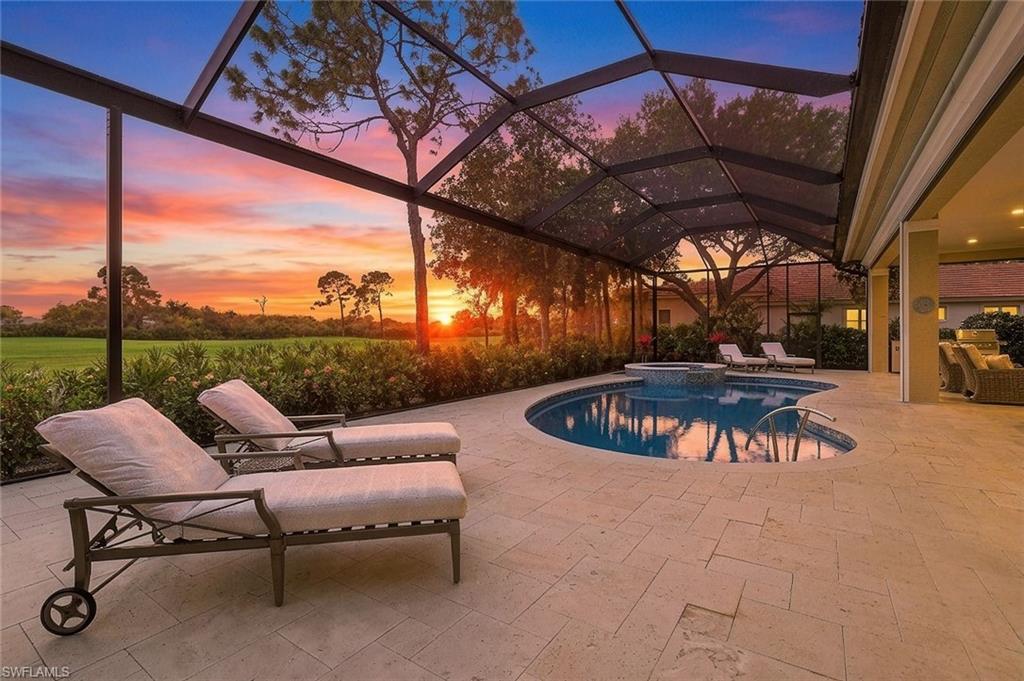The Three Ls of Real Estate: Location, Lot, Layout ... Perfectly positioned on a quiet, tree-lined CUL-DE-SAC STREET in the heart of the neighborhood, this exceptional residence is set on an oversized, nearly half-acre homesite, enjoying a coveted SOUTHERN exposure and breathtaking GOLF course VIEWS, beautifully framed by a natural preserve. The property is high and dry, located in a NO-FLOOD-hazard ZONE. COMPLETELY RENOVATED from top to bottom, this sprawling RANCH-STYLE home has been thoughtfully upgraded to today’s standards. Its OPEN-CONCEPT Great Room-Family Room design CREATES AN INVITING FLOW, encompassing three spacious bedroom suites, four full baths, and two versatile dens. All bedrooms with private en-suite baths and walk-in closets; the guest bath doubles as a pool bath. The two dens provide flexibility as a study, home office, or additional sleeping space. Light-filled interiors are enhanced by picture windows with transoms and ten-foot sliding glass doors, creating a seamless connection between indoor and outdoor living. Reimagined in a sophisticated transitional style, the home showcases timeless details such as rich crown molding, elevated ceilings, and designer fixtures. A neutral palette highlights the finest finishes, including intricate stone flooring, quartzite and granite countertops, and bespoke soft-close wood cabinetry. At the heart of the home, the chef’s kitchen strikes a perfect balance between style and functionality. A large island with counter seating anchors the room, surrounded by custom wood cabinetry with pull-out shelving and lighted glass-front upper cabinets. Top-tier appliances include a gas cooktop w/ pot filler, double ovens, and a warming drawer. A second dishwasher in the utility room offers added convenience. Ideal for entertaining, the fully equipped two-sided bar features illuminated display cabinetry, a wine cooler, beverage refrigerator, and ice maker. Embracing a true indoor-outdoor lifestyle, disappearing glass doors open to an expansive lanai—nearly 2,500 square feet of outdoor living space. Here, spectacular golf course views and vibrant sunset skies create a daily backdrop. The fully renovated outdoors includes a saltwater pool and spa, both gas heated, a poolside kitchen, shell-stone decking, and generous areas for shaded relaxation and sun-filled lounging, all within a new panoramic screen enclosure. The full-size 3-car garage (with room for your golf cart) features a side-entry design, so the home’s striking mahogany double entry doors take center stage. Recent hurricane-code upgrades include a flat-tile roof, impact-resistant windows throughout, and electric Storm Smart shutters on the lanai. This listing offers the option for IMMEDIATE GOLF membership at the prestigious Collier's Reserve CC known for its Arthur Hills eco-conscious golf course, as well as tennis, pickleball, fitness & wellness programs, bocce, kayaking, and an active social scene with both casual and fine dining.